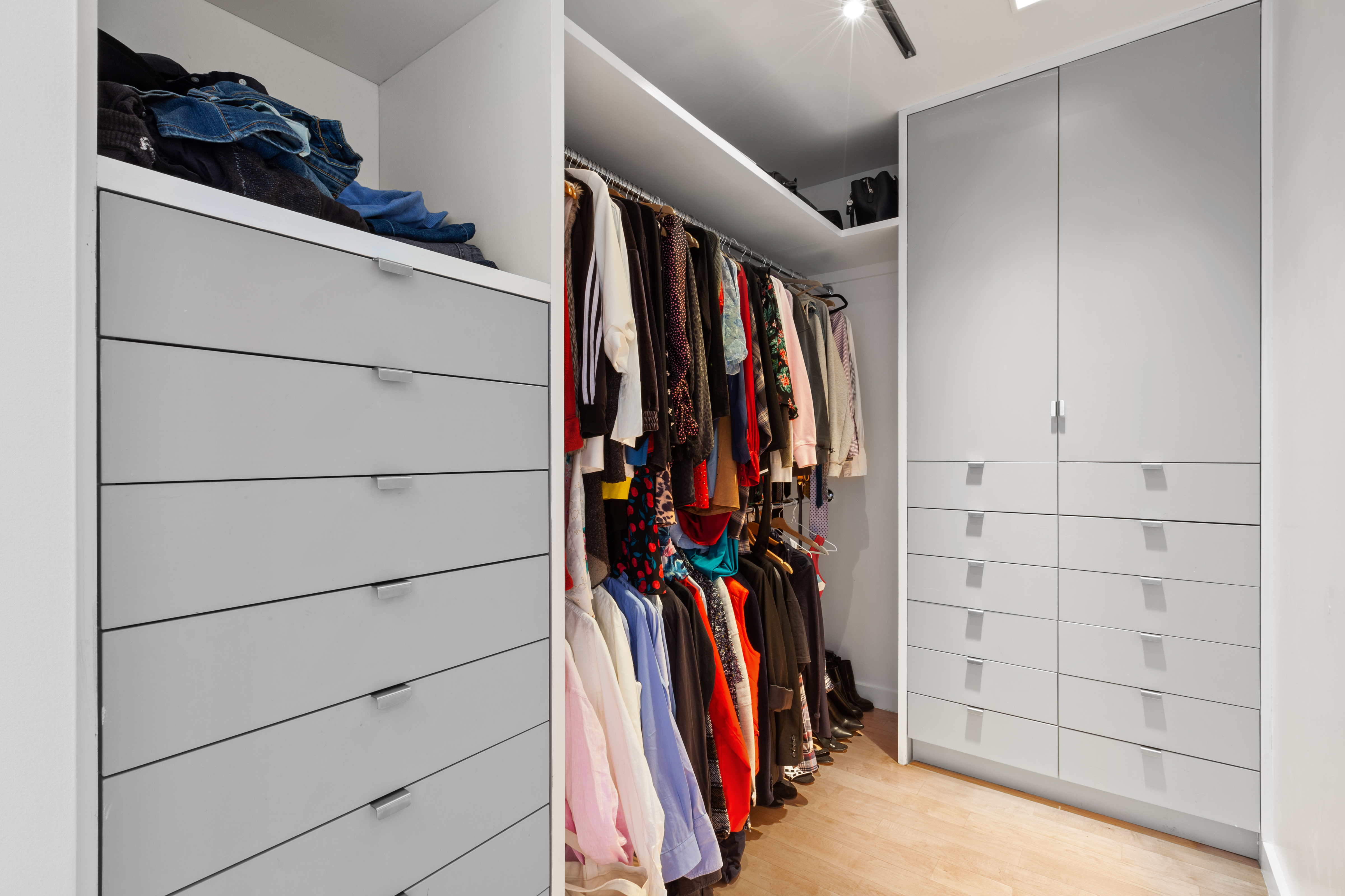 447 West 18th Street, Unit 7A Manhattan, NY 10011 - Photo 7 of 16 a view of walk in closet with clothes