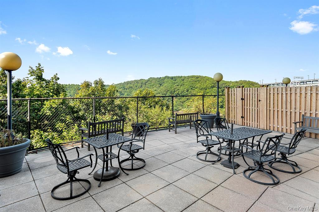 2400 Johnson Avenue, Unit 3B Bronx, NY 10463 - Photo 21 of 28 a view of a chairs and table in patio