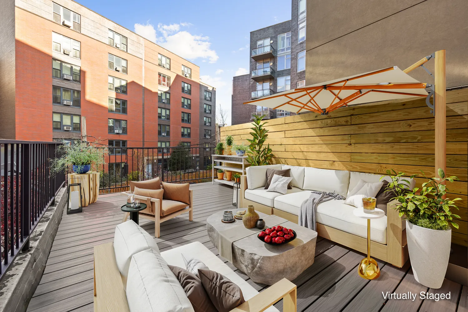 a view of a patio with couches and potted plants
