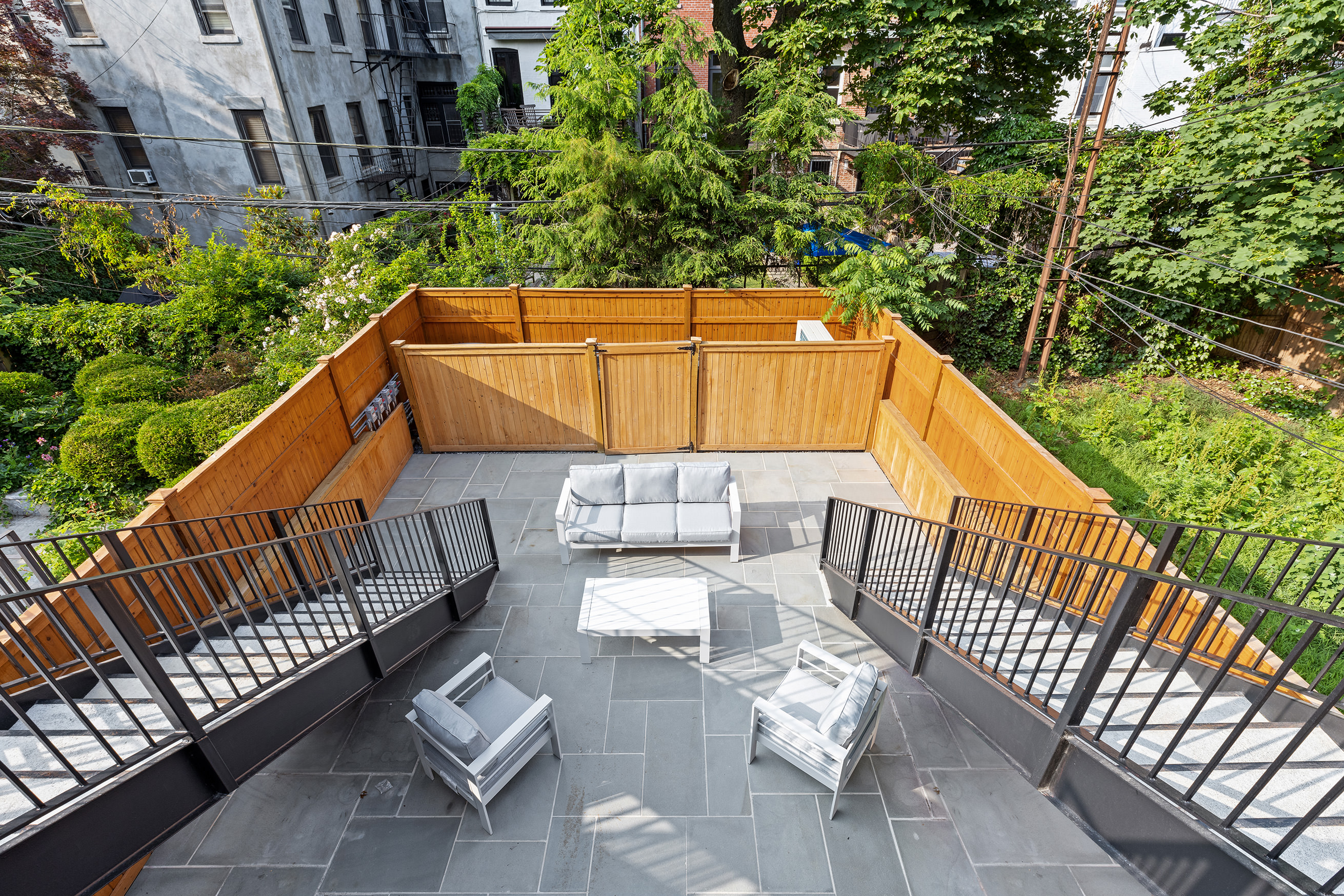 149 Kane Street Brooklyn, NY 11231 - Photo 21 of 26 a balcony with wooden floor and outdoor seating