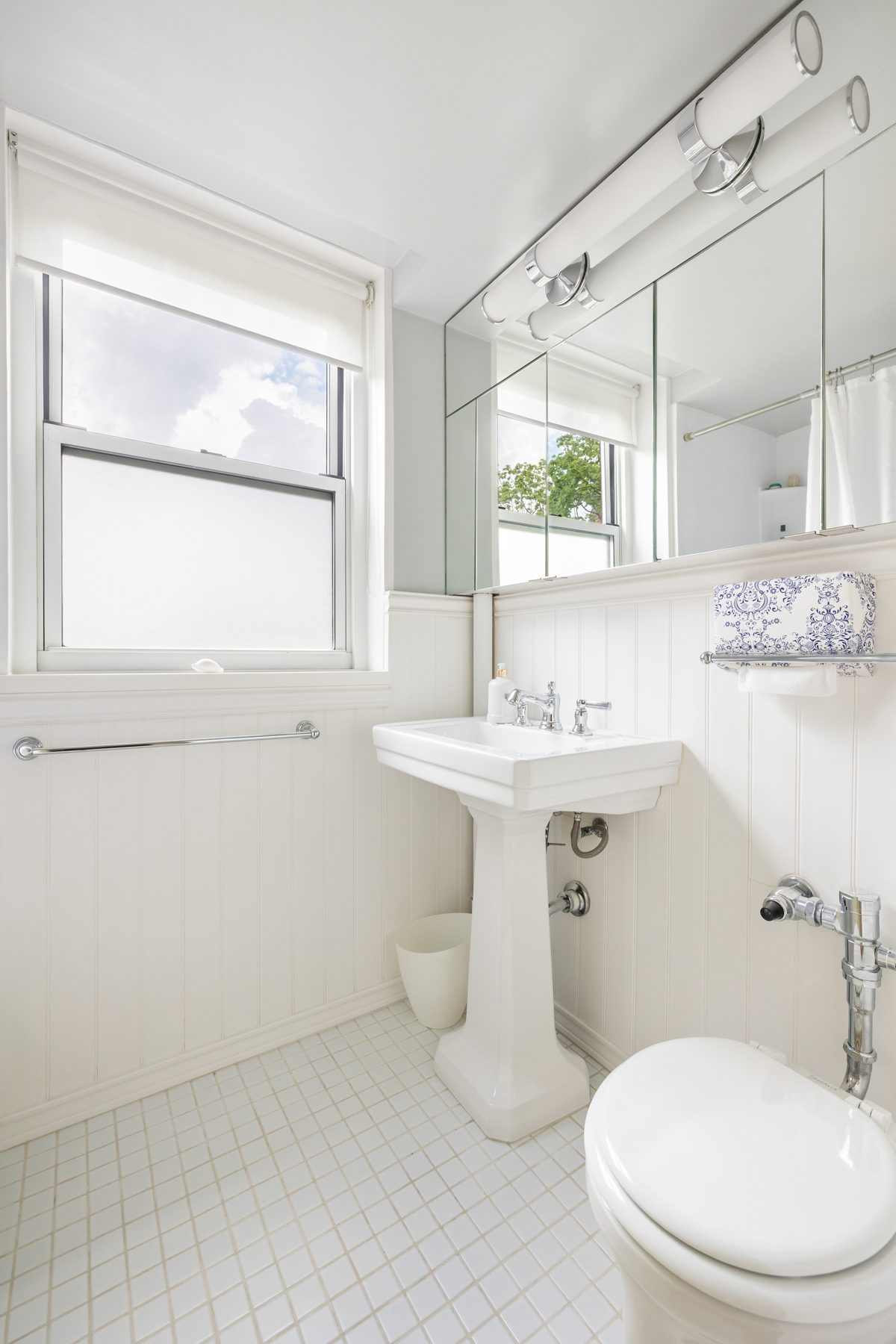 35-11 85th Street, Unit 5H Queens, NY 11372 - Photo 8 of 11 a bathroom with a sink toilet and mirror