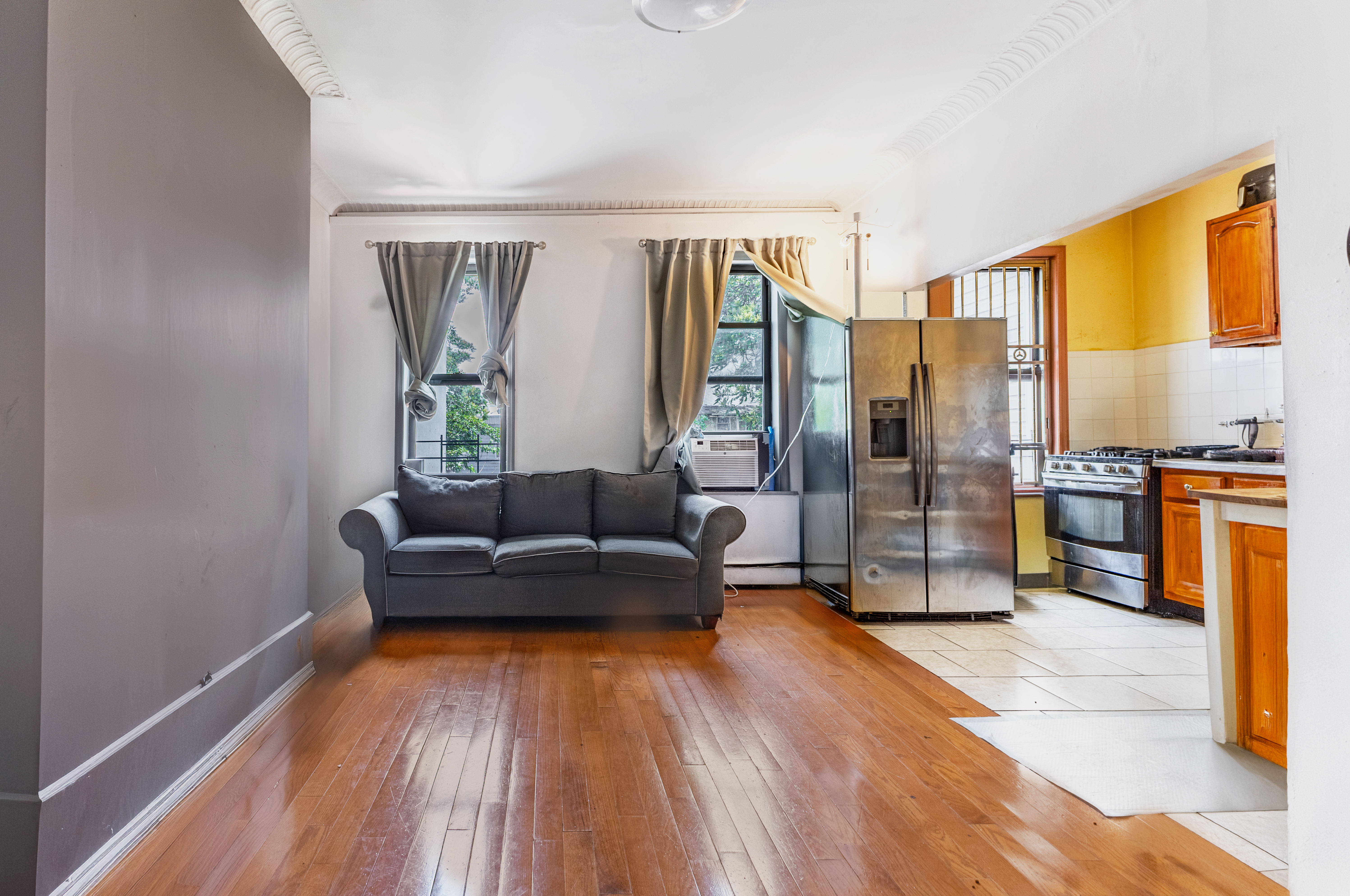 52 Himrod Street Brooklyn, NY 11221 - Photo 5 of 16 a living room with furniture and large window