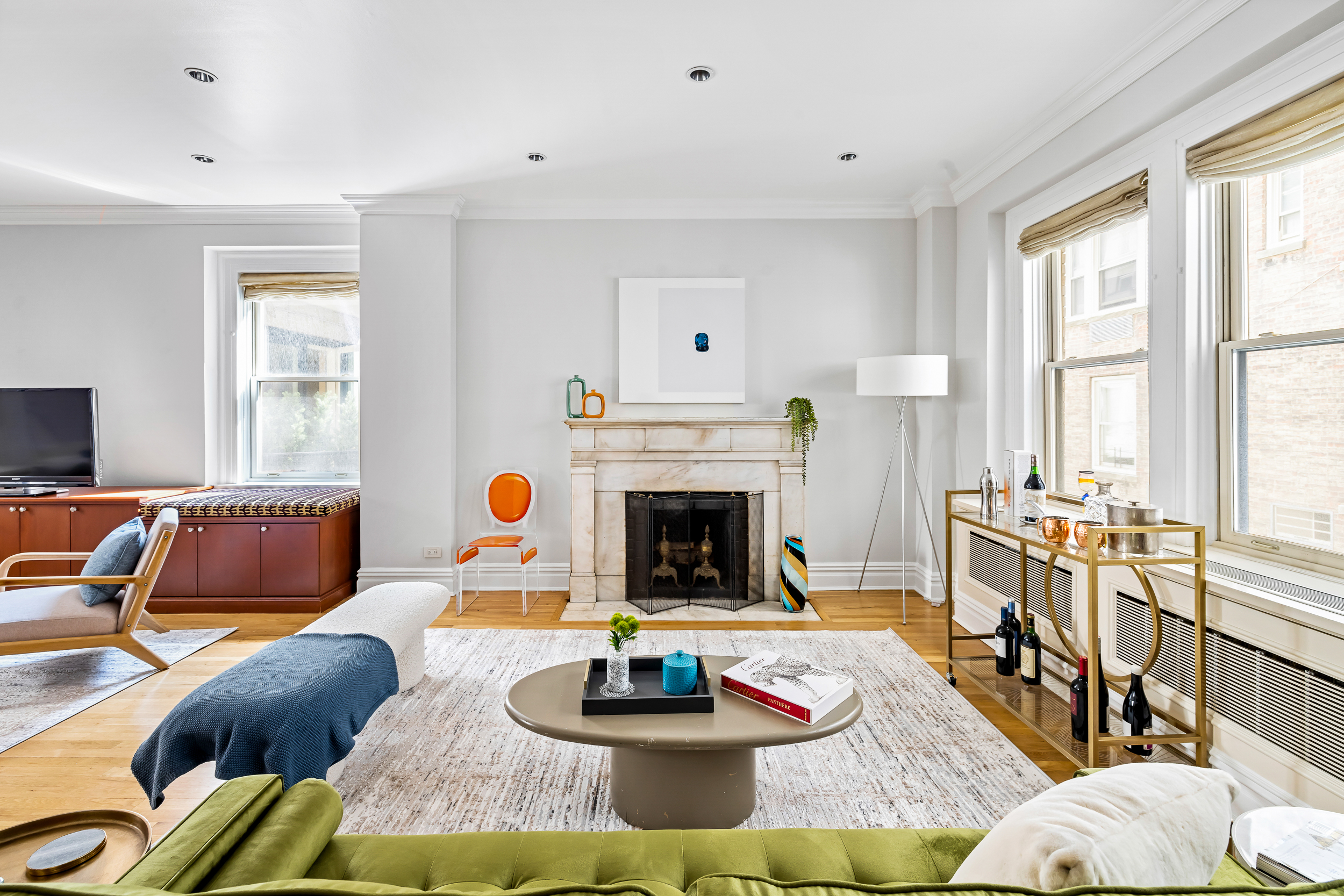 829 Park Avenue, Unit 2D/3D Manhattan, NY 10021 - Photo 4 of 21 a living room with furniture and a fireplace