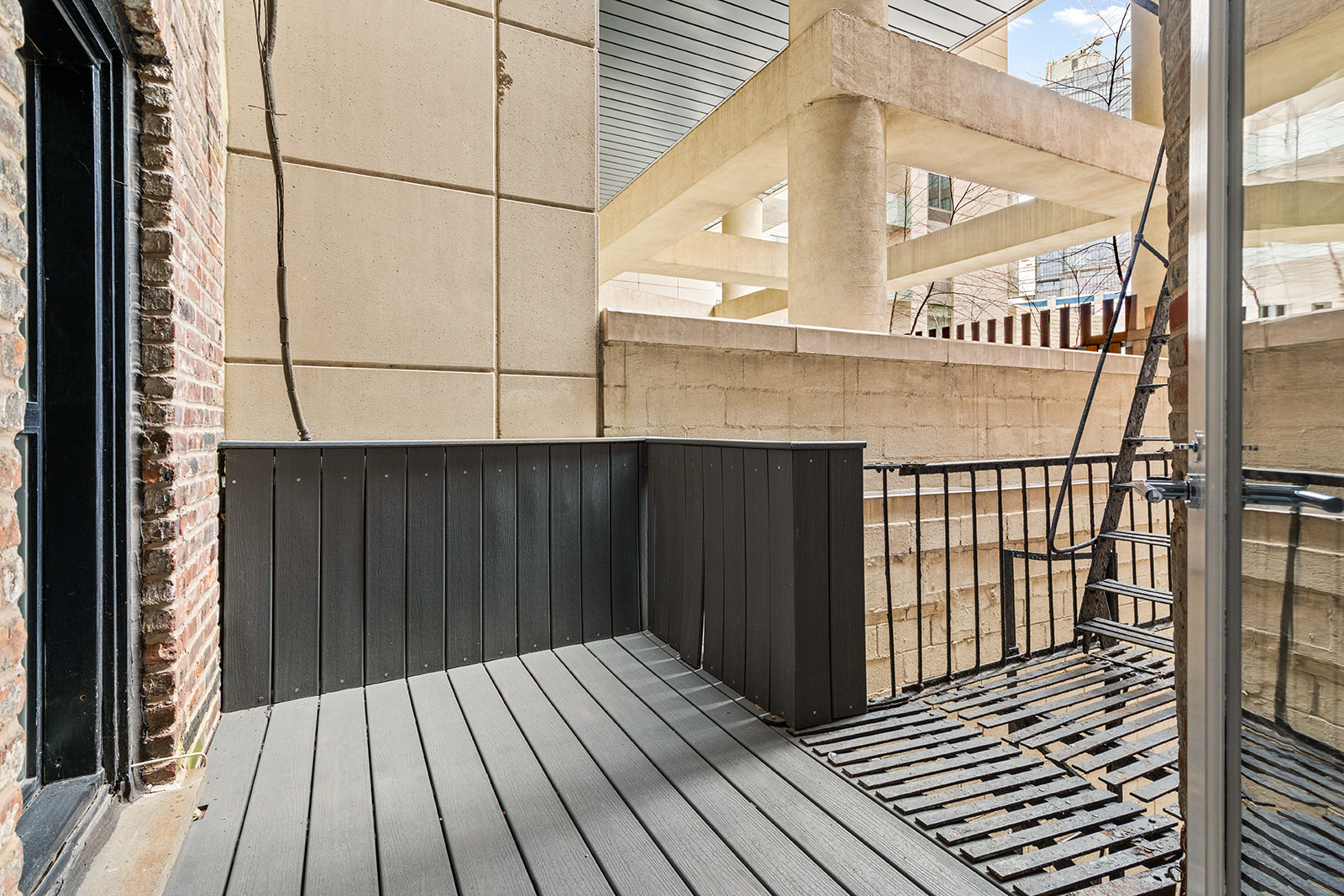 57 Thompson Street, Unit 2CD Manhattan, NY 10012 - Photo 3 of 13 a view of a balcony with wooden floor