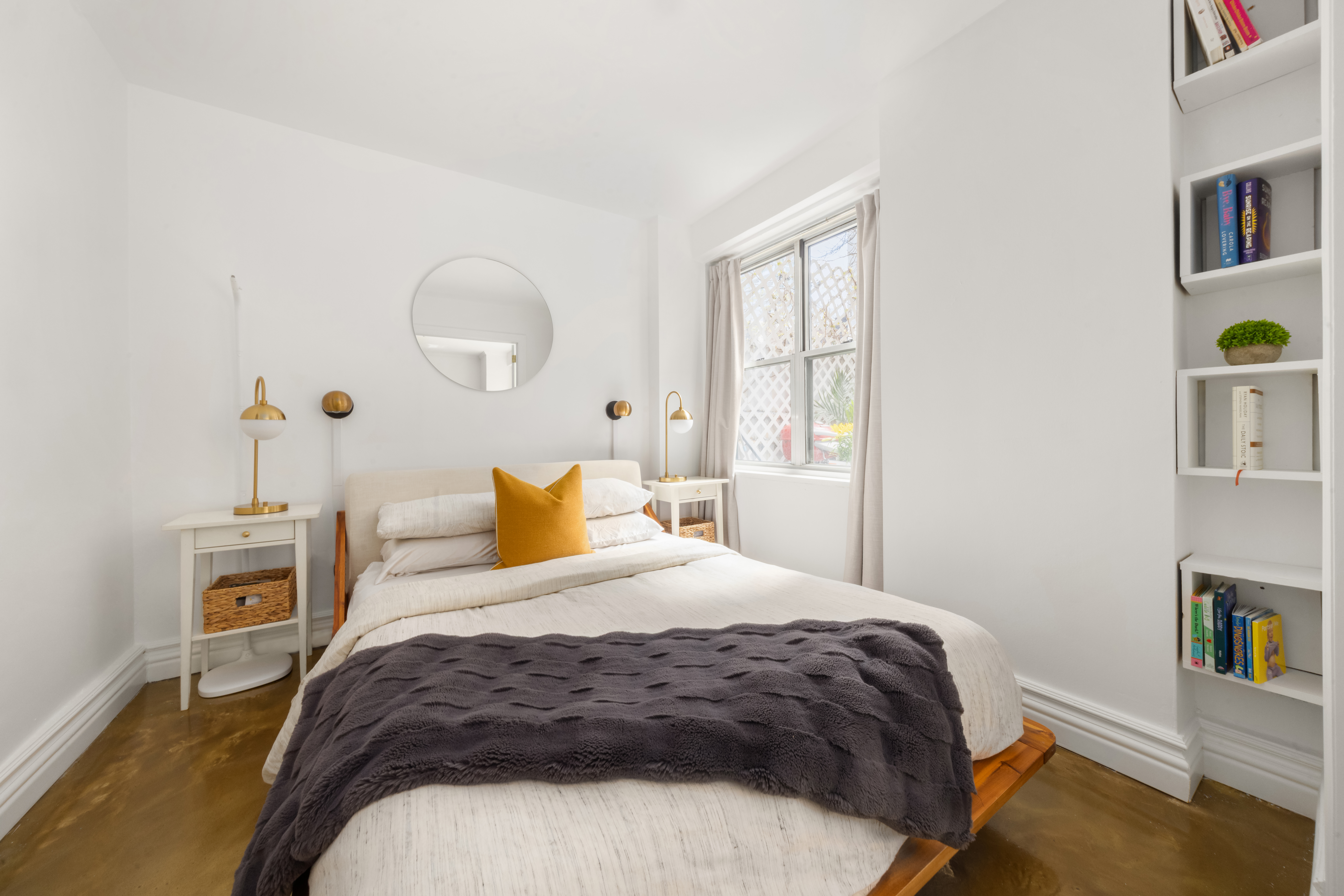 150 East 61st Street, Unit 2A Manhattan, NY 10065 - Photo 6 of 9 a bedroom with a bed and window