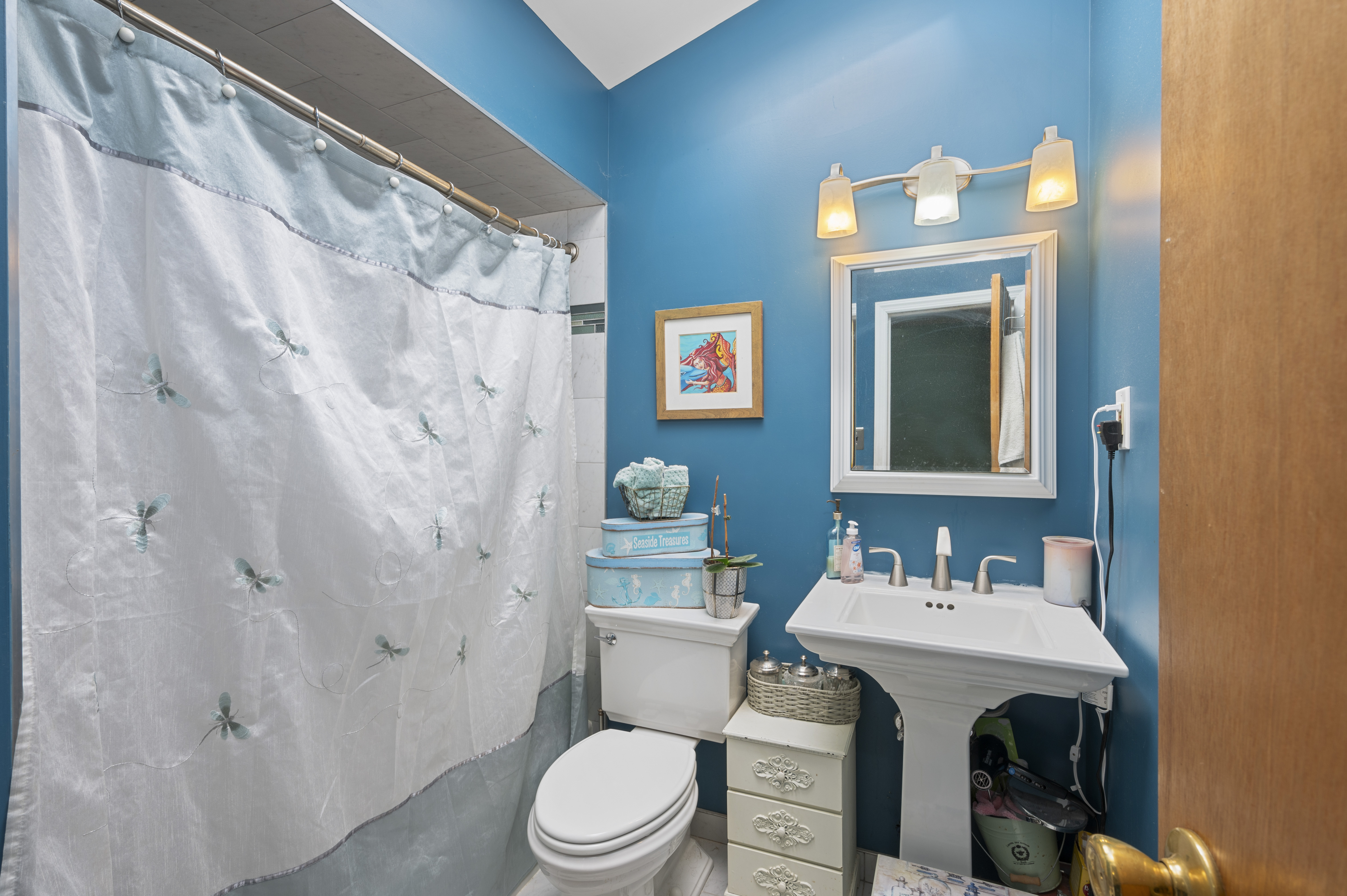 20 Eric Lane Staten Island, NY 10308 - Photo 13 of 20 a bathroom with a sink vanity mirror and toilet