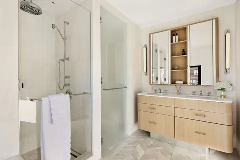 a bathroom with a double vanity sink mirror and double