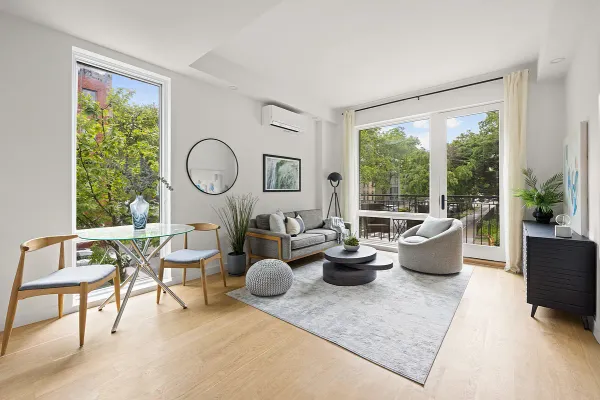 a living room with furniture and a large window