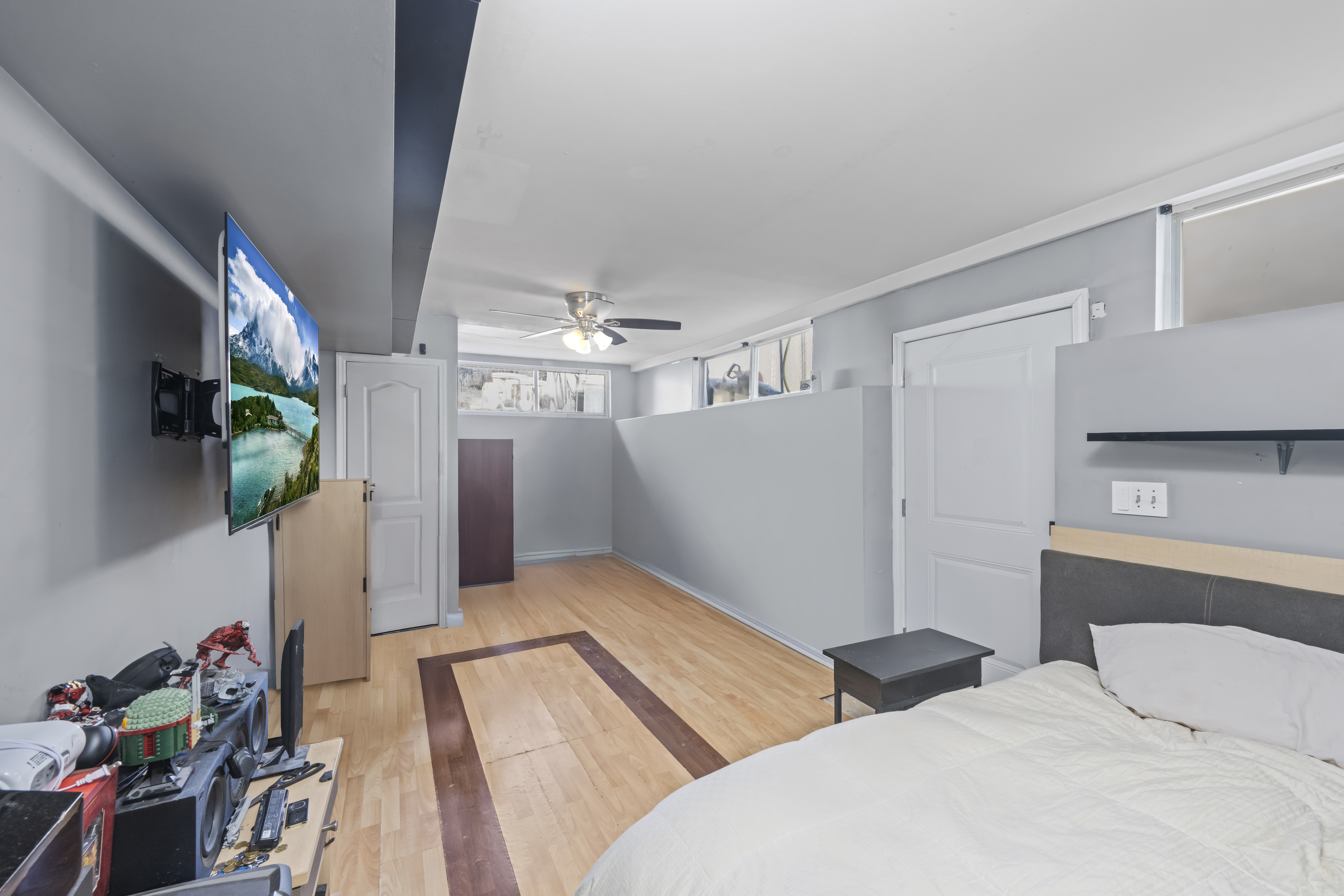 55 Sideview Avenue Staten Island, NY 10314 - Photo 19 of 28 a bedroom with bed and a chandelier