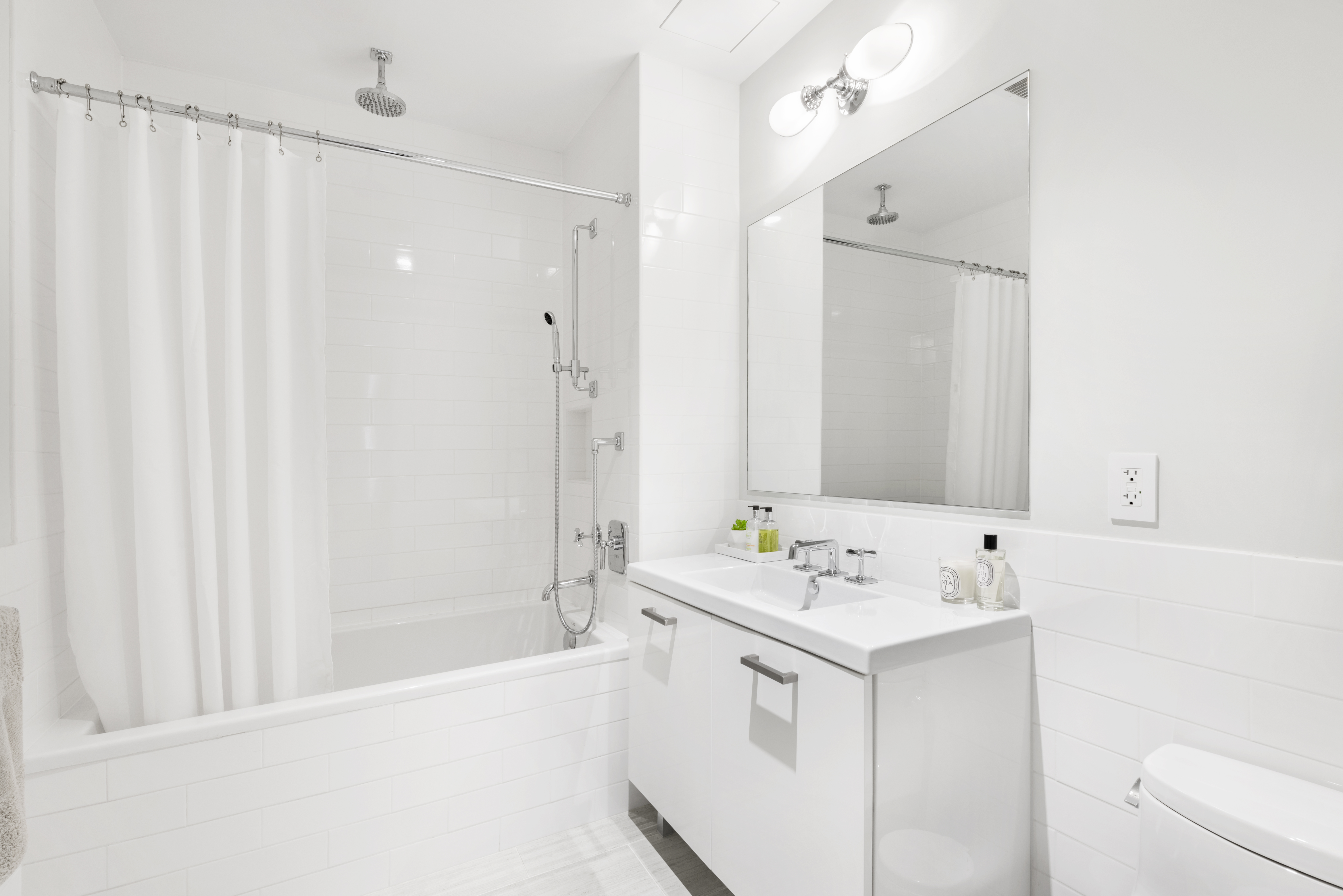 64 East 1st Street, Unit TH1 Manhattan, NY 10003 - Photo 12 of 15 a bathroom with a sink a vanity and a mirror