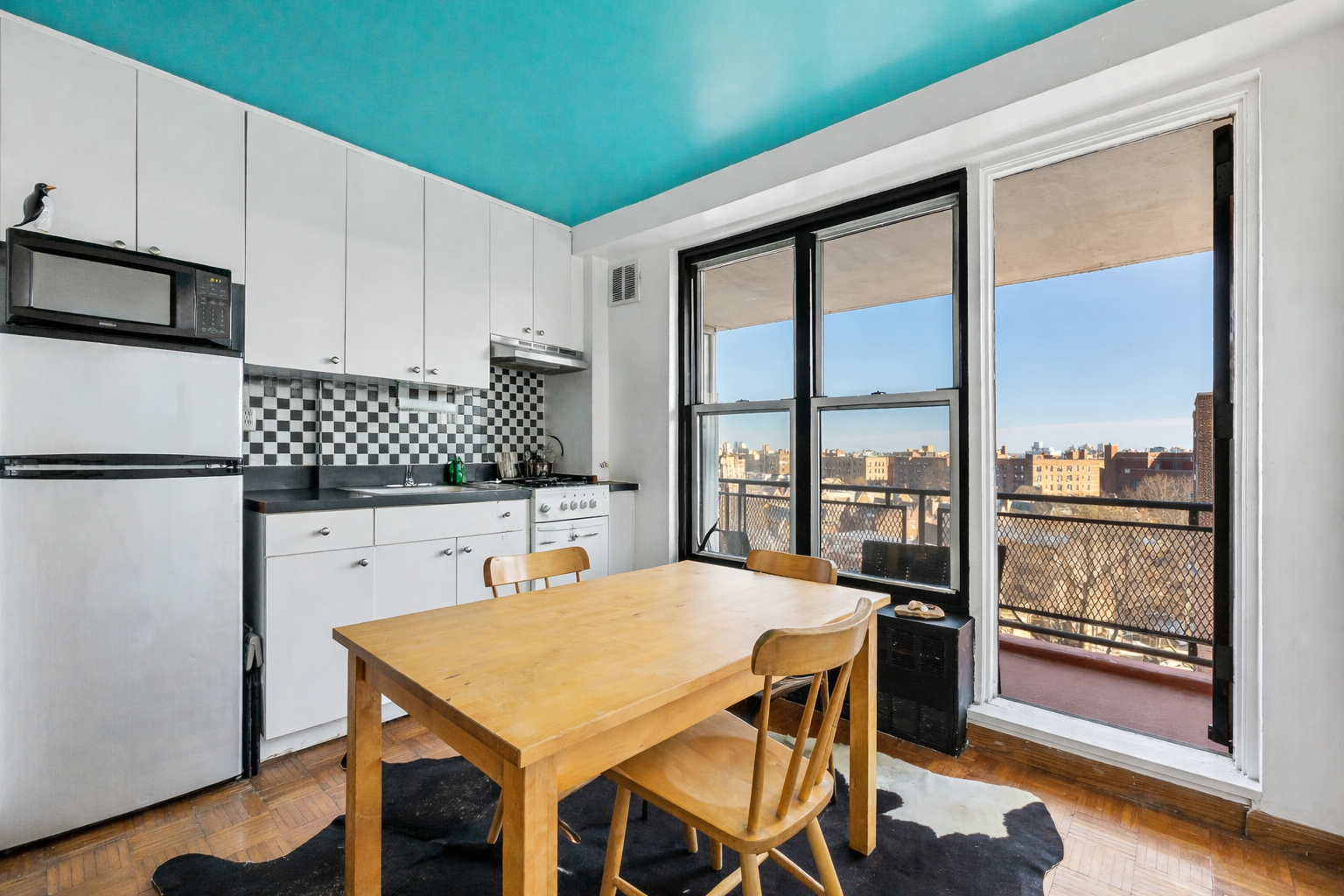 35-11 85th Street, Unit 9A Queens, NY 11372 - Photo 2 of 8 a view of a dining room with furniture window and wooden floor
