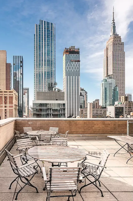 111 East 30th Street, Unit 16C Manhattan, NY 10016 - Photo 11 of 13 a view of a swimming pool with outdoor seating