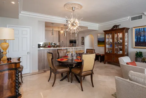 a dining room with furniture and window