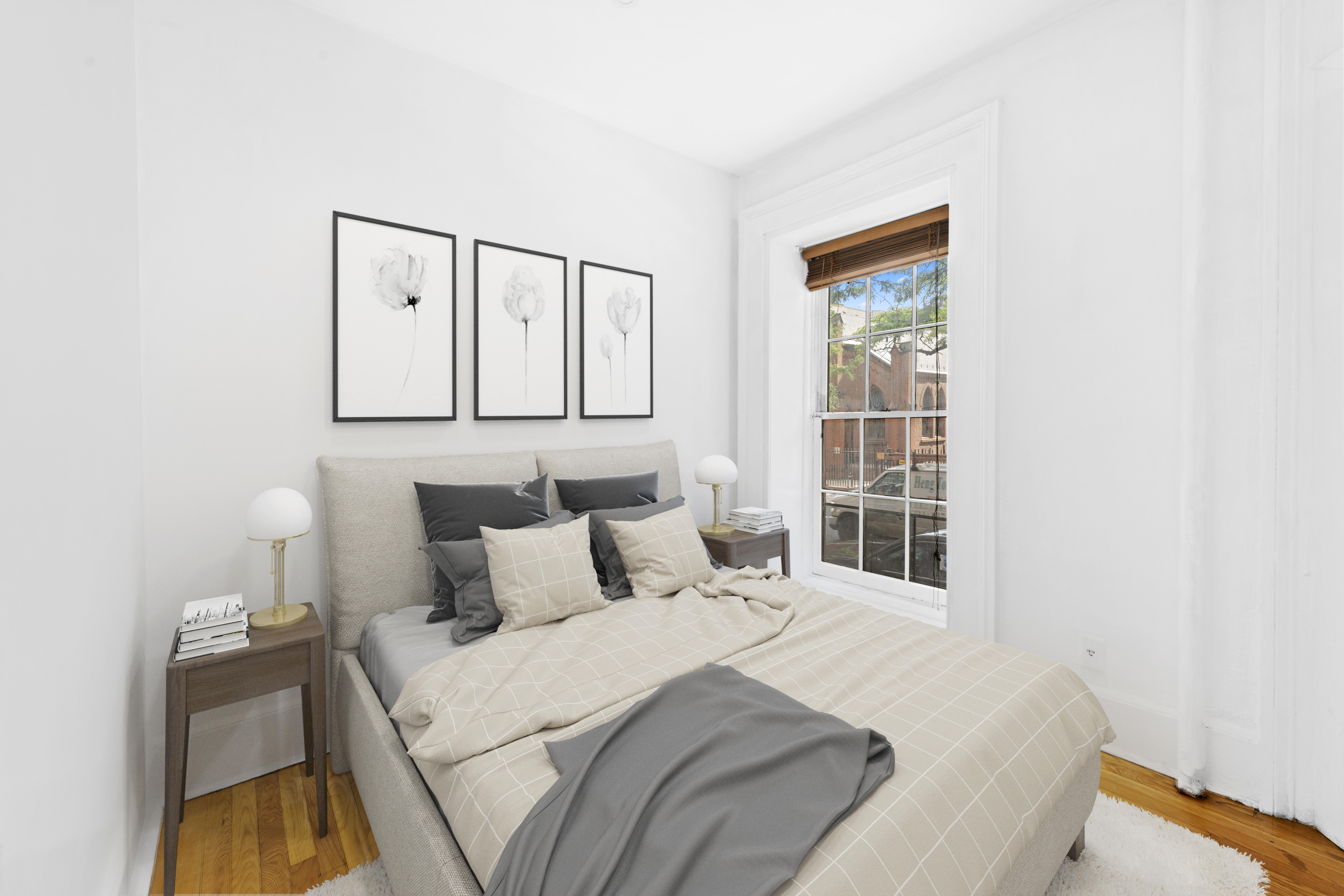 339 West 20th Street, Unit 2F Manhattan, NY 10011 - Photo 2 of 7 a bedroom with a bed and a window