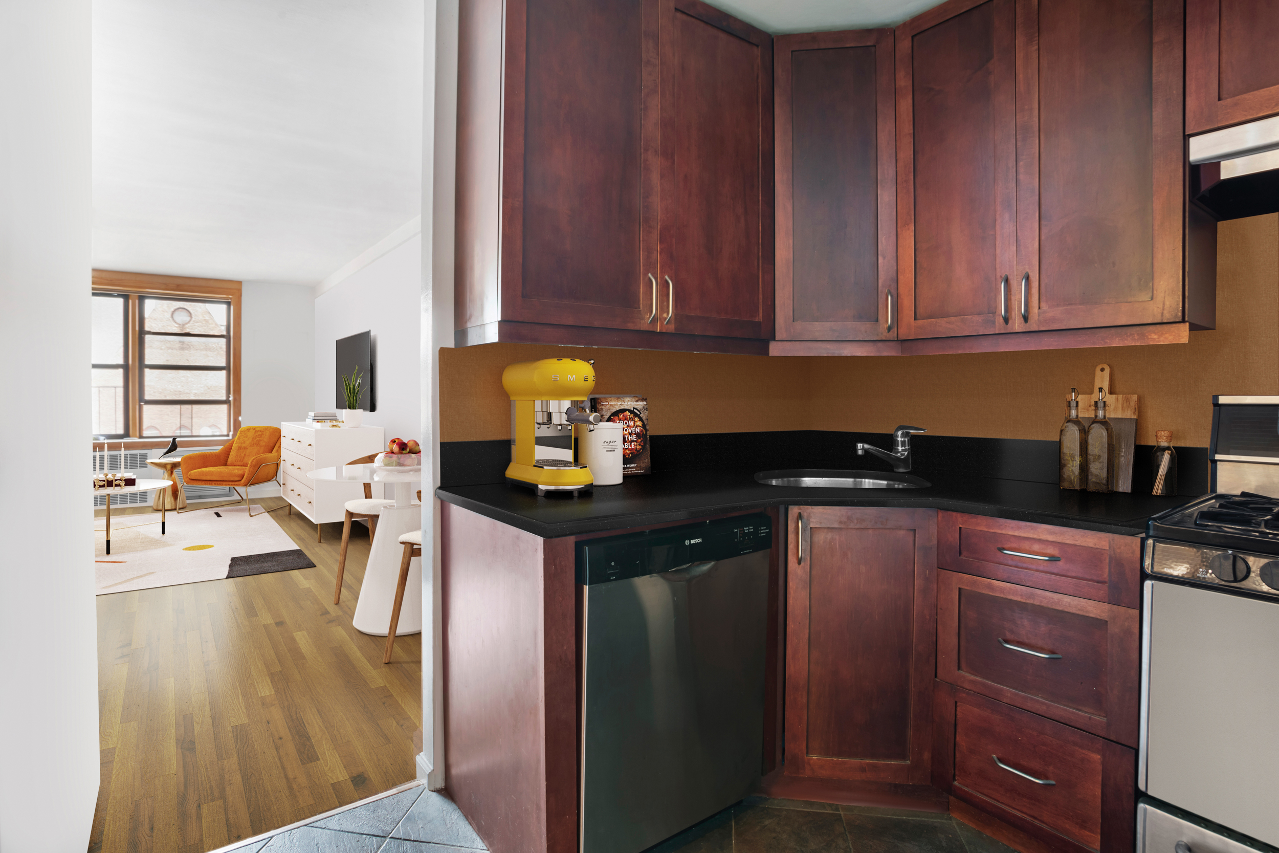 165 Christopher Street, Unit 6J Manhattan, NY 10014 - Photo 4 of 16 a kitchen with a sink cabinets and wooden floor