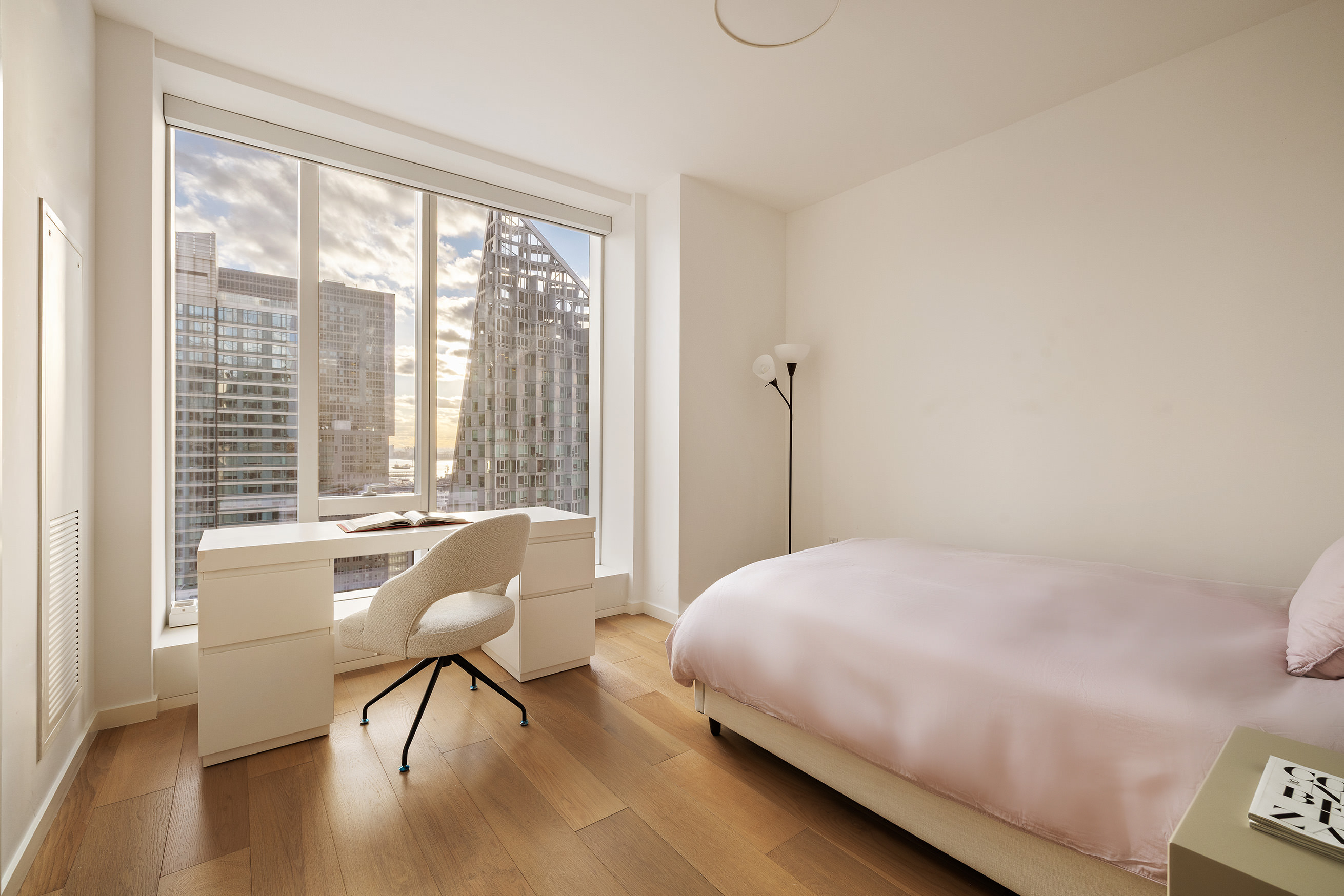 1 West End Avenue, Unit 25F Manhattan, NY 10023 - Photo 12 of 15 a bedroom with a bed and a large window