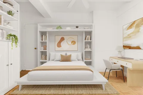 a bedroom with a bed and a tv on the dresser