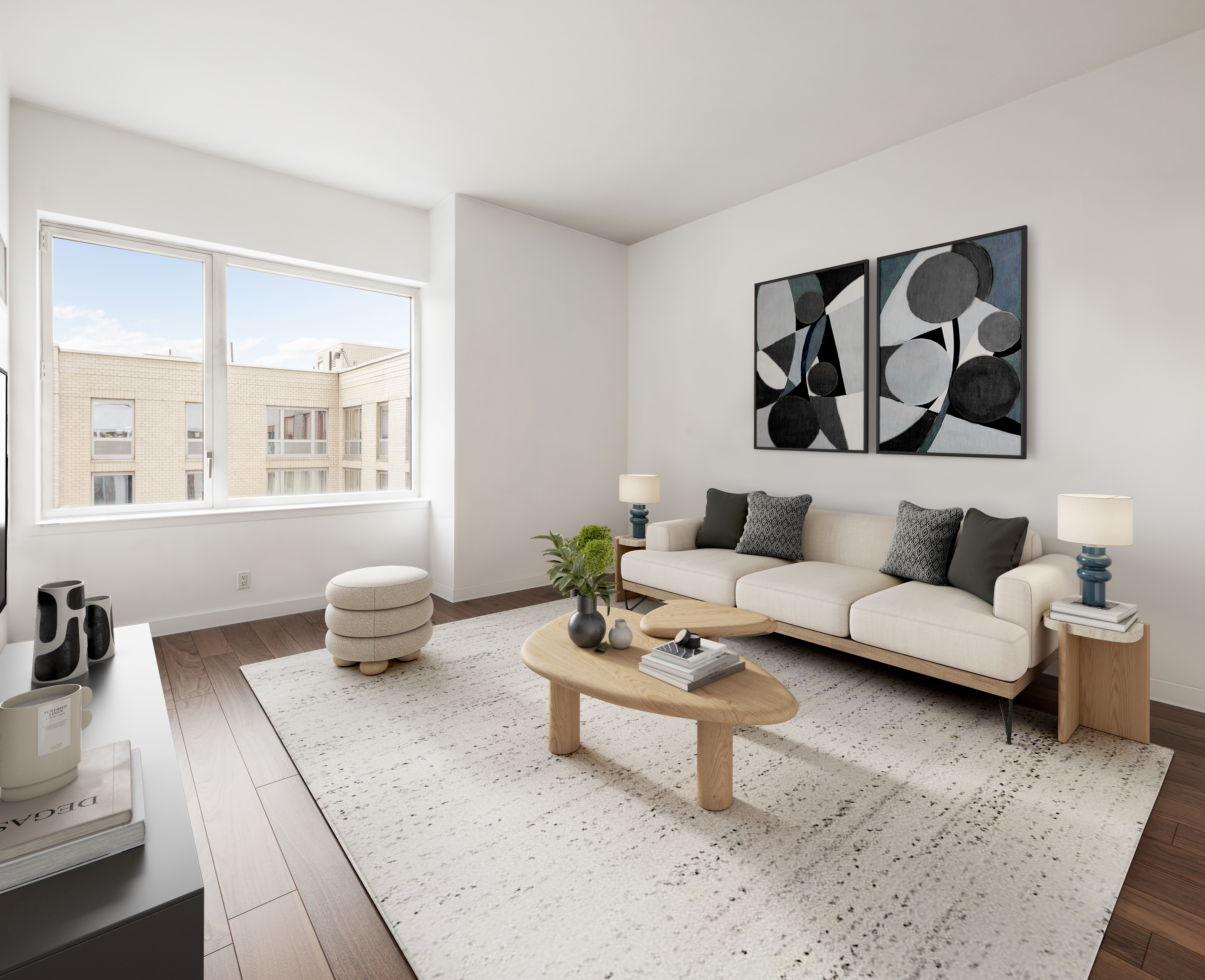 22 North 6th Street, Unit 9L Brooklyn, NY 11249 - Photo 2 of 6 a living room with furniture and wooden floor