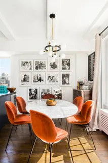 a dining room with furniture and wooden floor