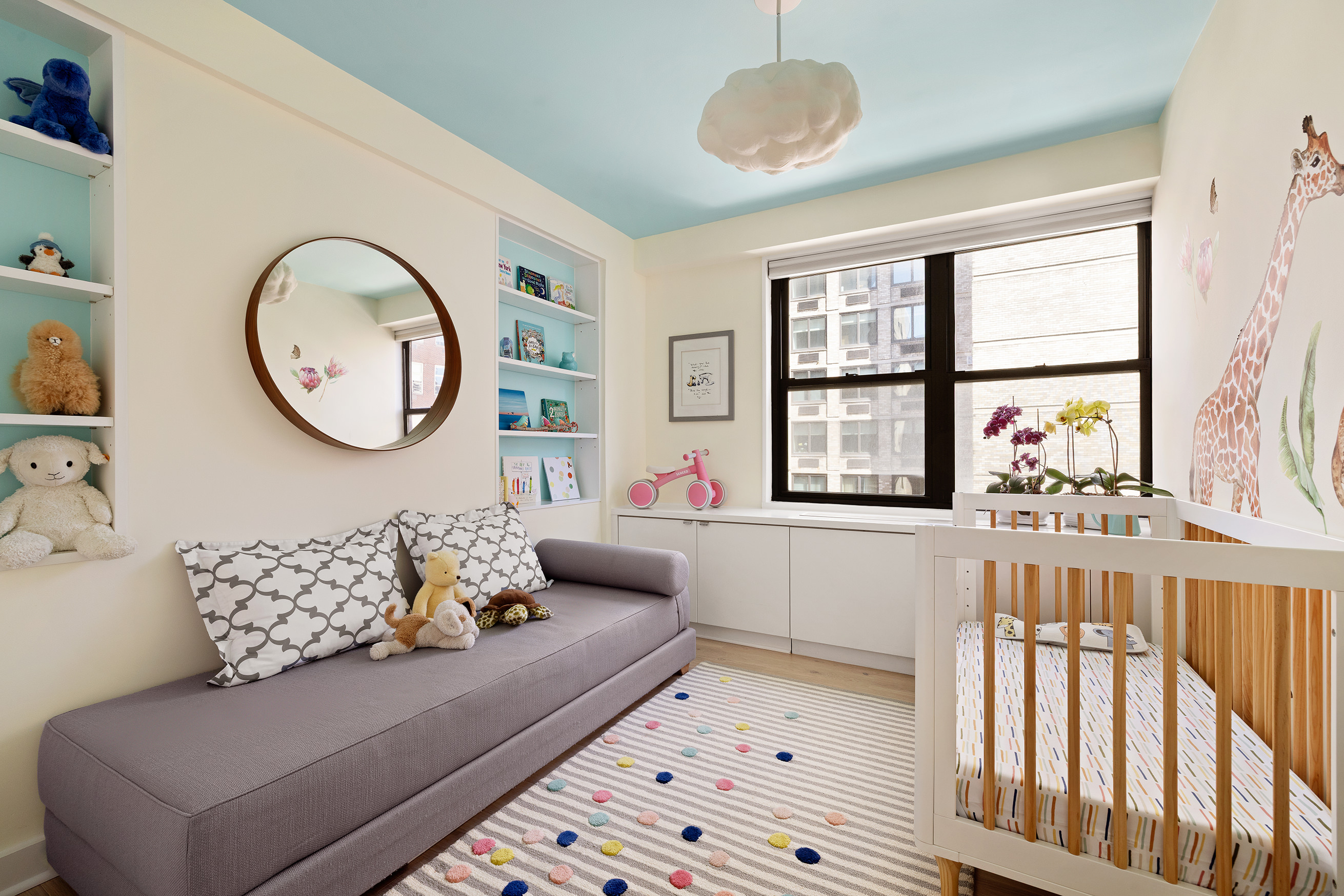 1065 Park Avenue, Unit 10CD Manhattan, NY 10128 - Photo 5 of 10 a living room with furniture and a large window
