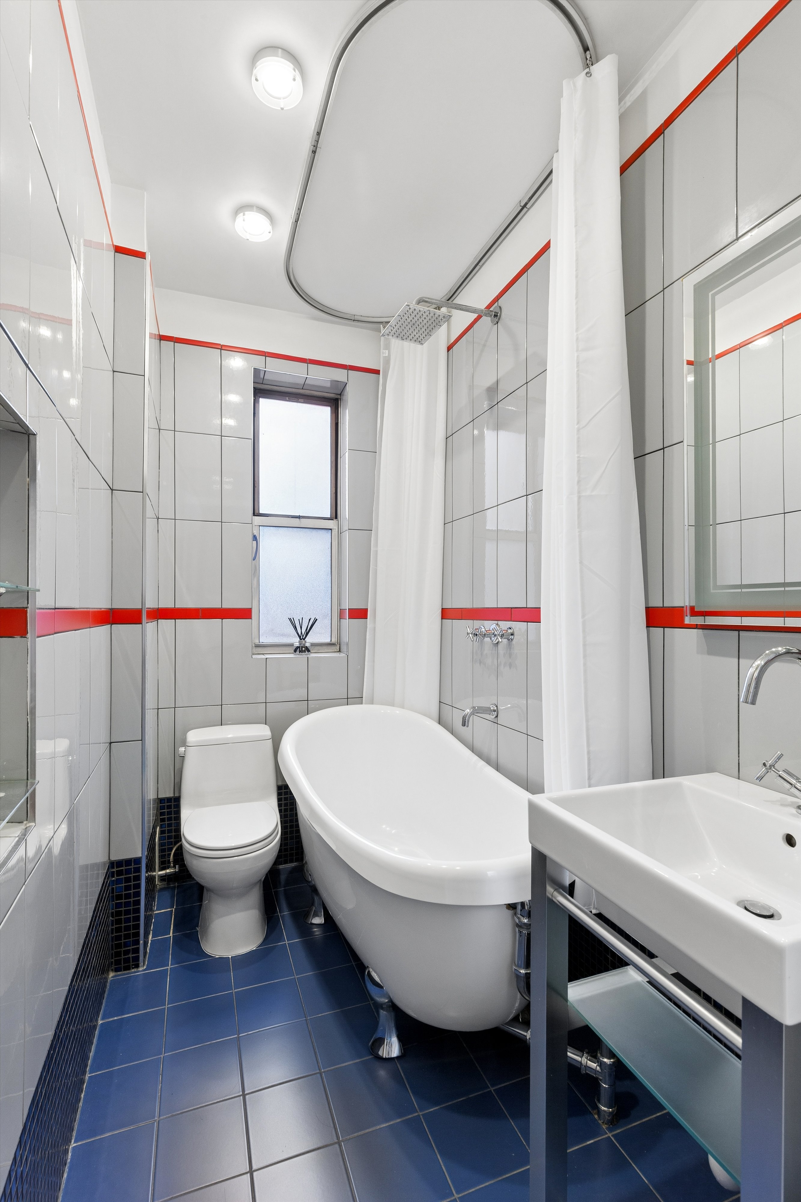 680 West 204th Street, Unit 5F Manhattan, NY 10034 - Photo 7 of 15 a bathroom with a sink and a toilet