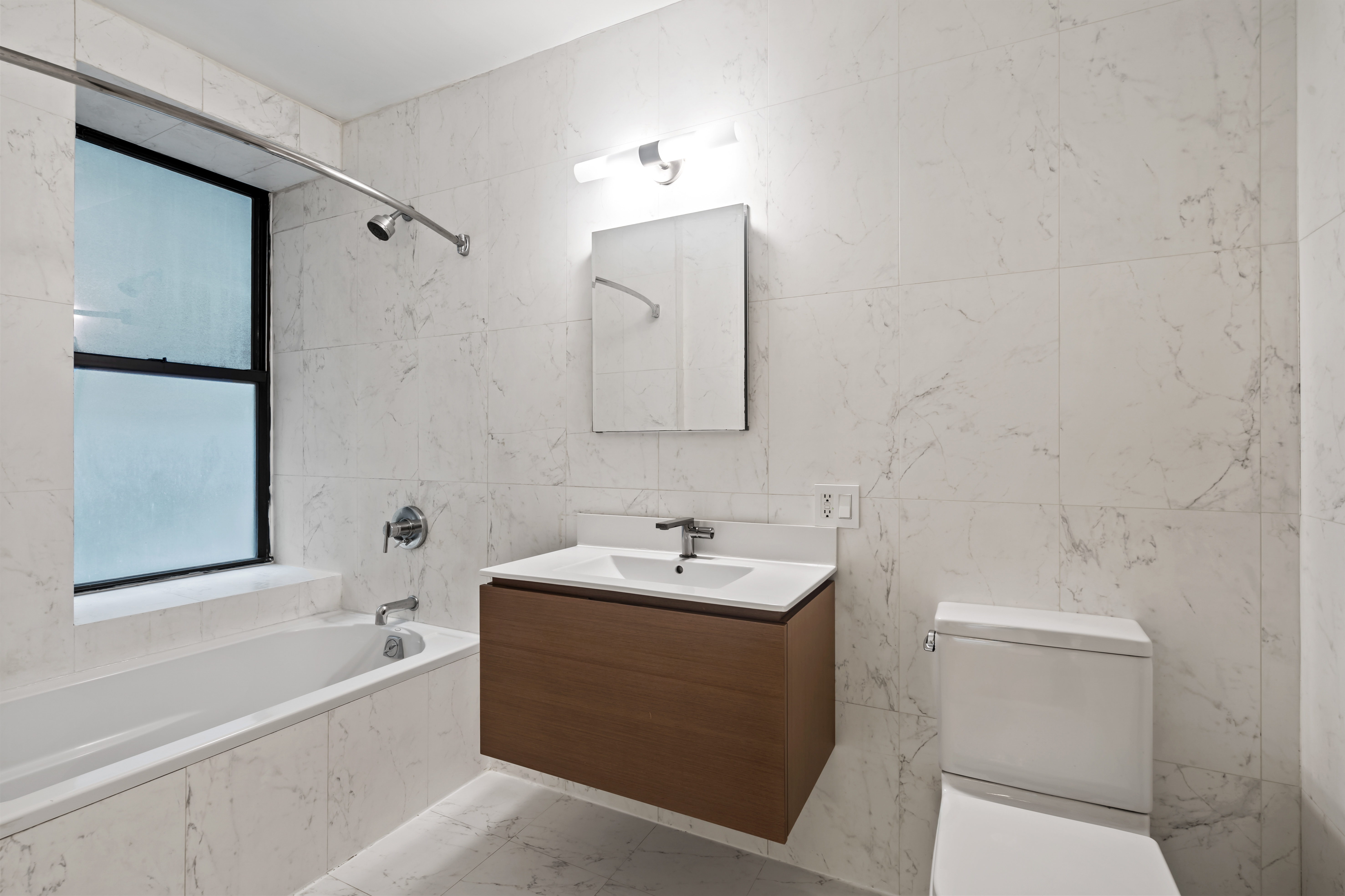 305 West 150th Street, Unit 206 Manhattan, NY 10039 - Photo 8 of 18 a bathroom with a sink a toilet and shower