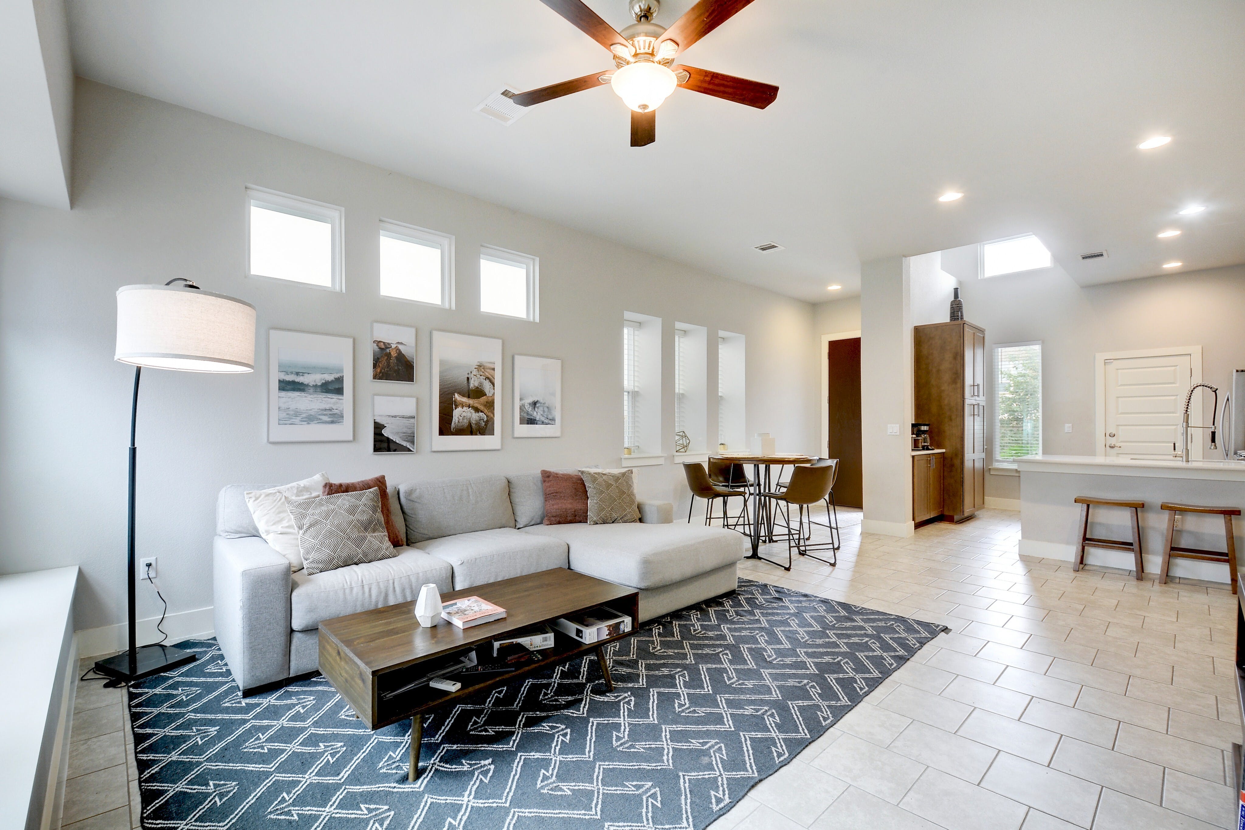 5400 Daimler Drive Austin, TX 78744 - Photo 6 of 27 a living room with furniture and a chandelier