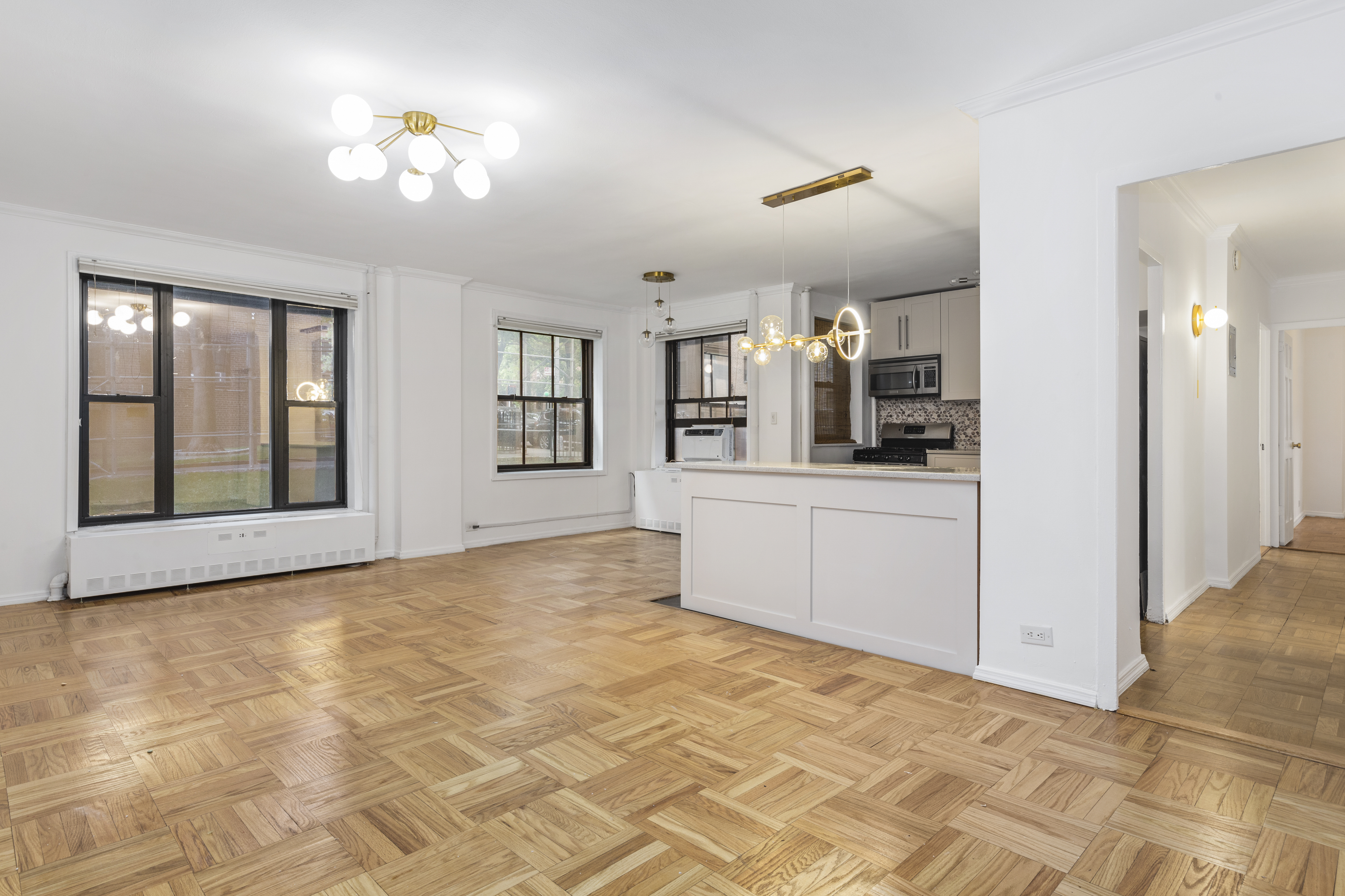 355 Clinton Avenue, Unit F1 Brooklyn, NY 11238 - Photo 16 of 20 a view of a kitchen with a sink hardwood floor and a living room