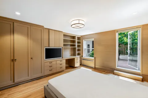 a bedroom with furniture and window