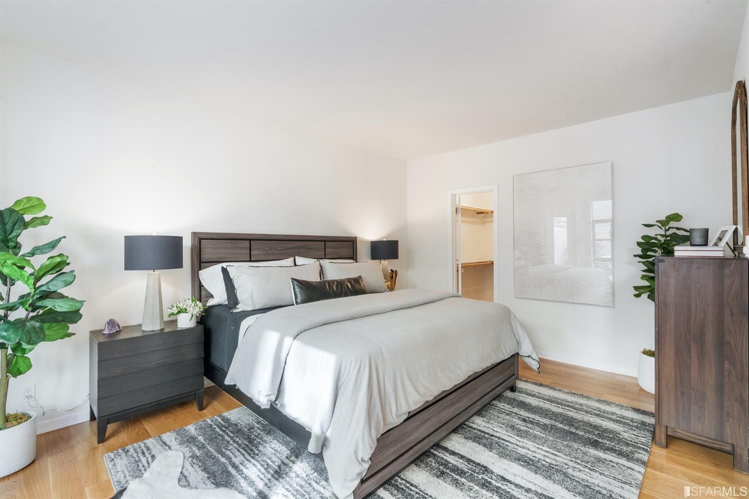 460 Francisco Street, Unit 103 San Francisco, CA 94133 - Photo 3 of 8 a bed room with a bed and a potted plant