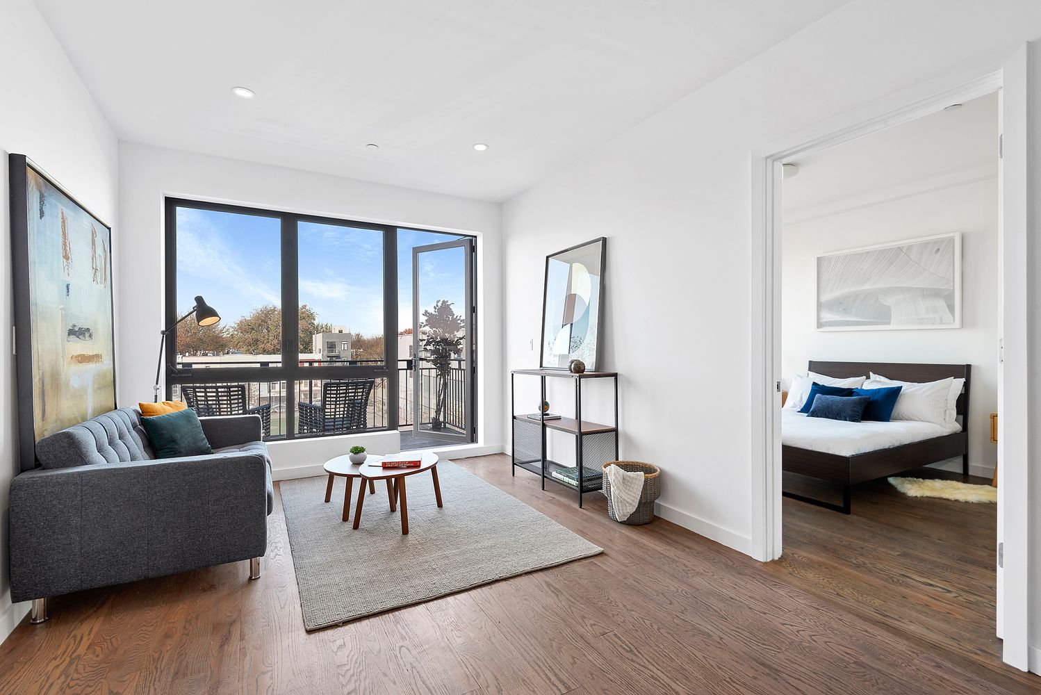 116 Covert Street, Unit 4A Brooklyn, NY 11207 - Photo 1 of 7 a living room with furniture and a large window