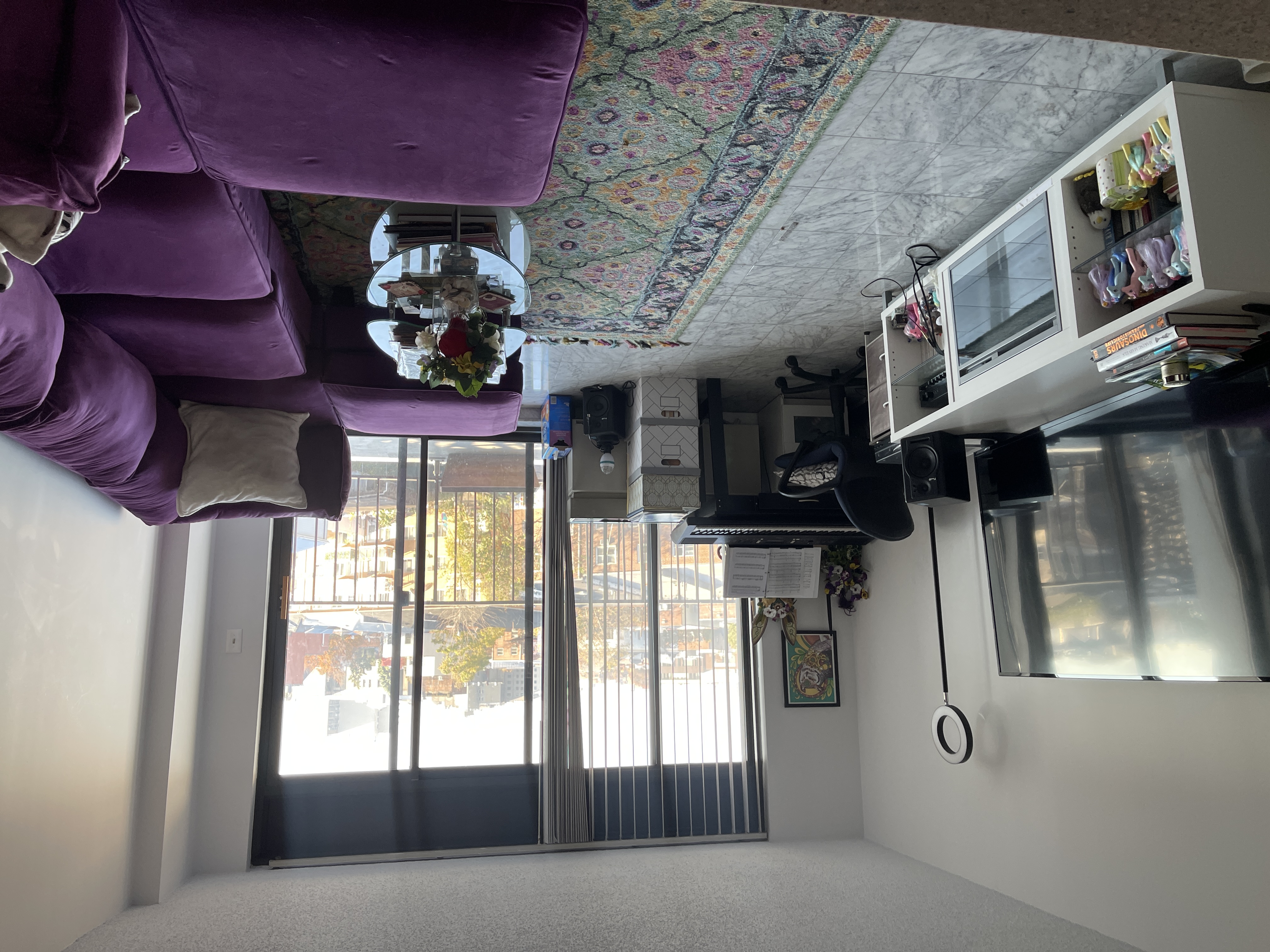 25-40 Shore Boulevard, Unit 5B Queens, NY 11102 - Photo 2 of 24 a living room with furniture and a flat screen tv