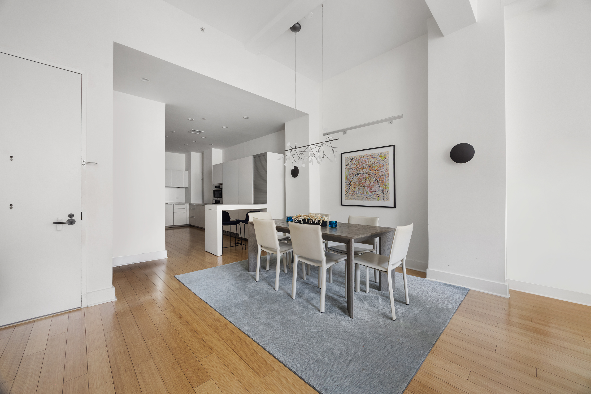 415 Greenwich Street, Unit 5D Manhattan, NY 10013 - Photo 4 of 16 a view of a dining room with furniture and wooden floor