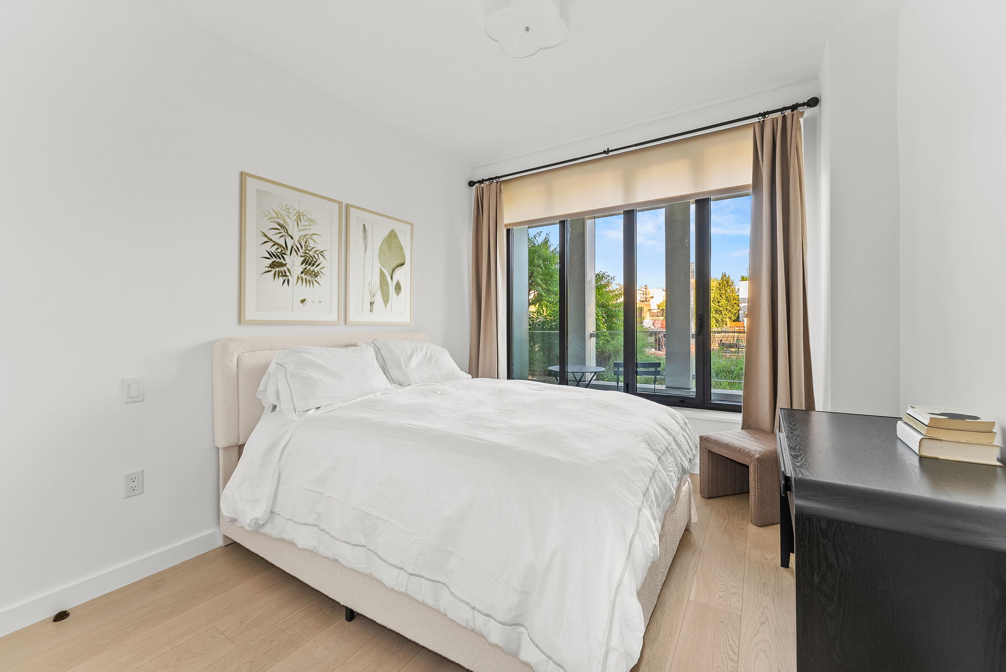 58 St Marks Place, Unit 206 Brooklyn, NY 11217 - Photo 5 of 27 a bedroom with a bed and a large window