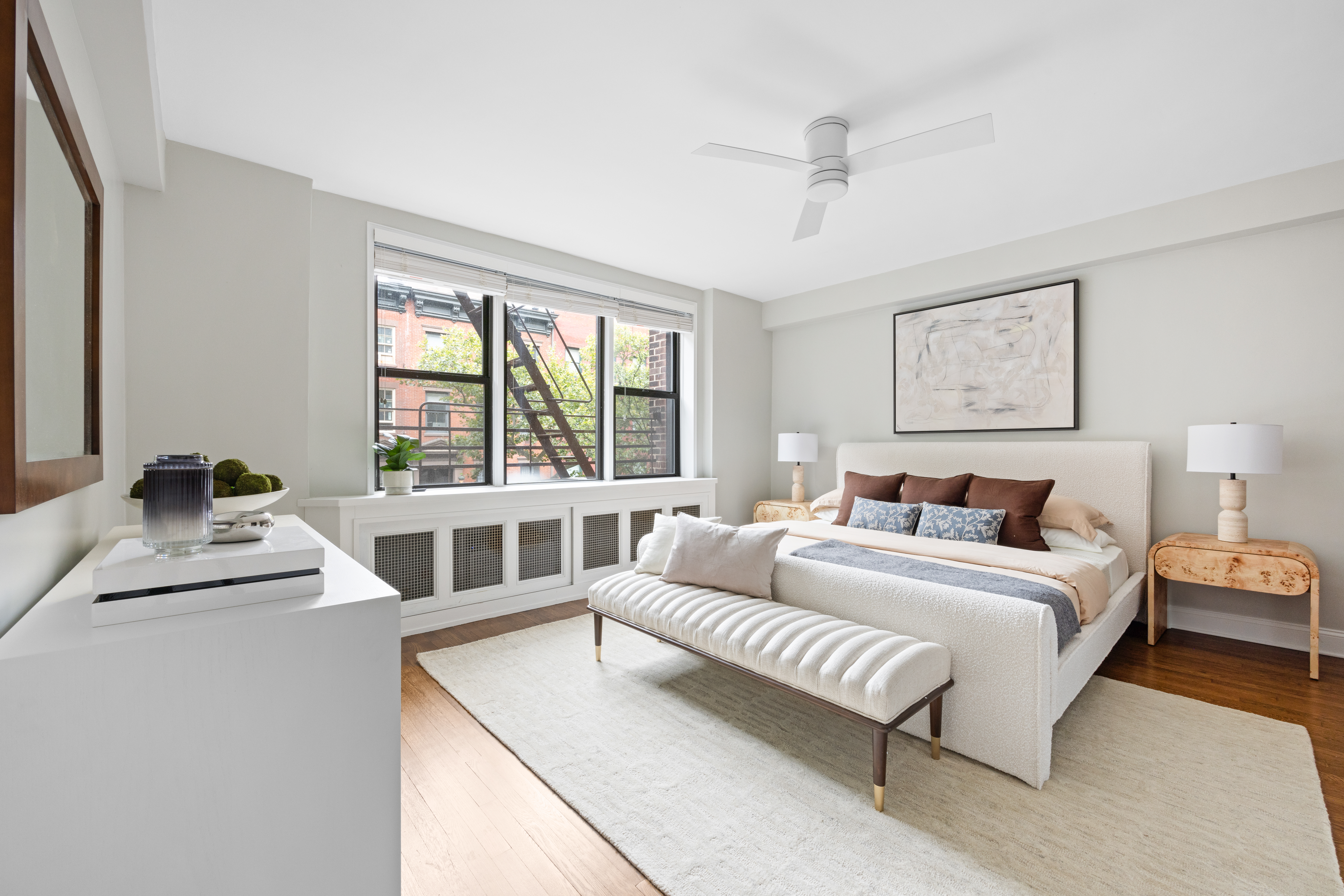 211 East 18th Street, Unit 2O Manhattan, NY 10003 - Photo 6 of 14 a spacious bedroom with a bed and a window