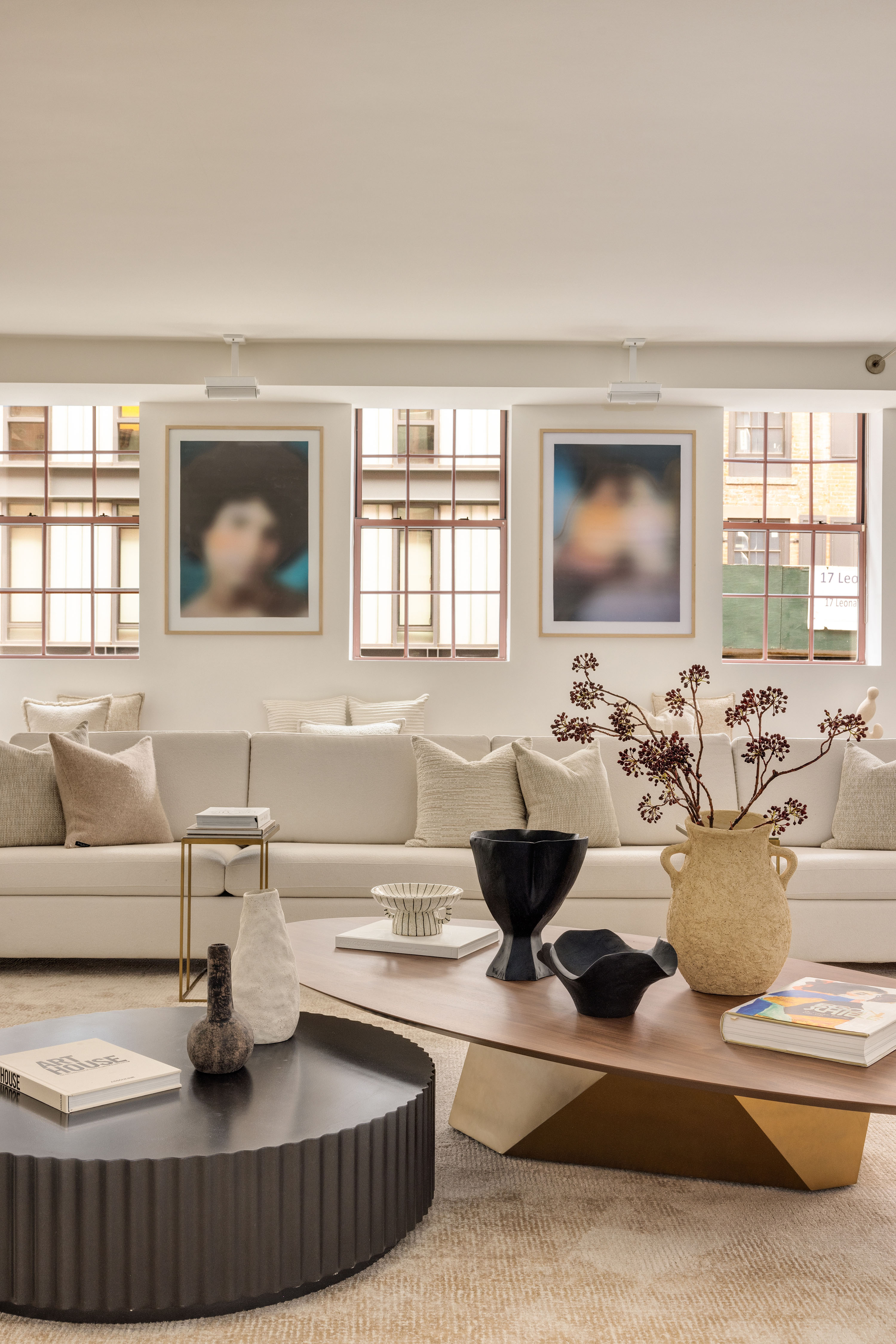 18 Leonard Street, Unit 2D Manhattan, NY 10013 - Photo 3 of 22 a living room with furniture and a flat screen tv