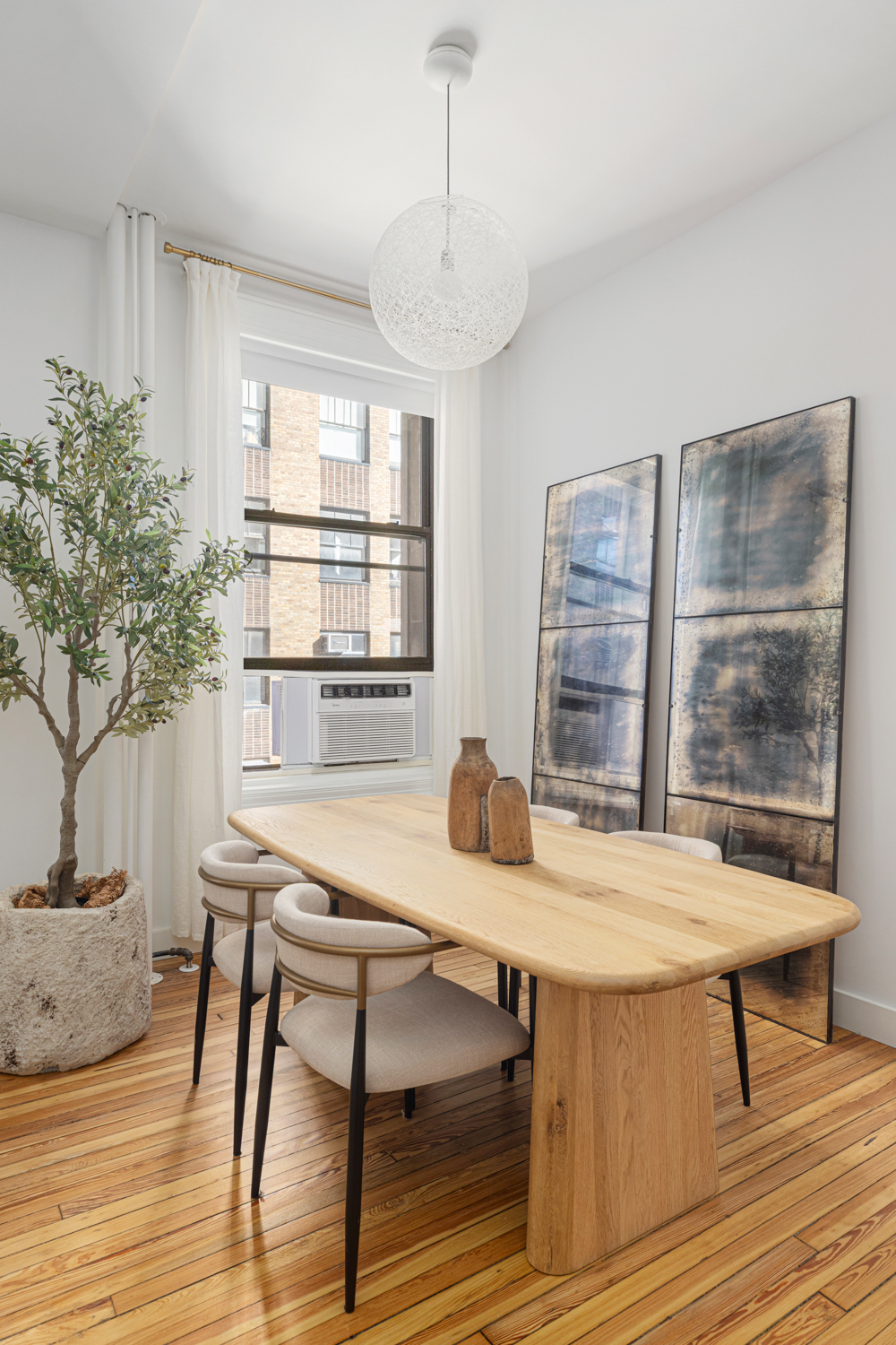 395 Broadway, Unit 5B Manhattan, NY 10013 - Photo 2 of 13 a view of a dining room with furniture and window