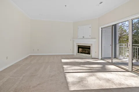 a view of empty room with floor to ceiling window