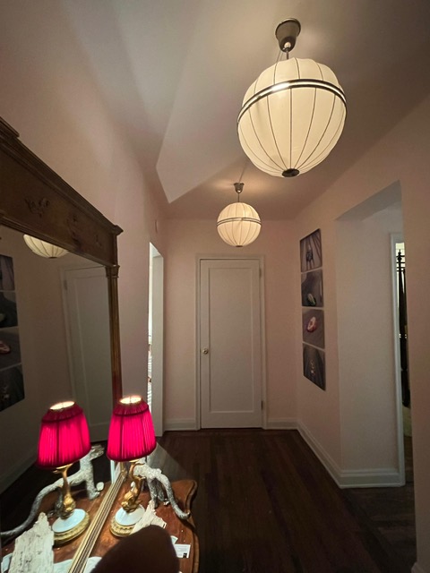 435 West 23rd Street, Unit 7B Manhattan, NY 10011 - Photo 6 of 23 an empty room with wooden floor and windows