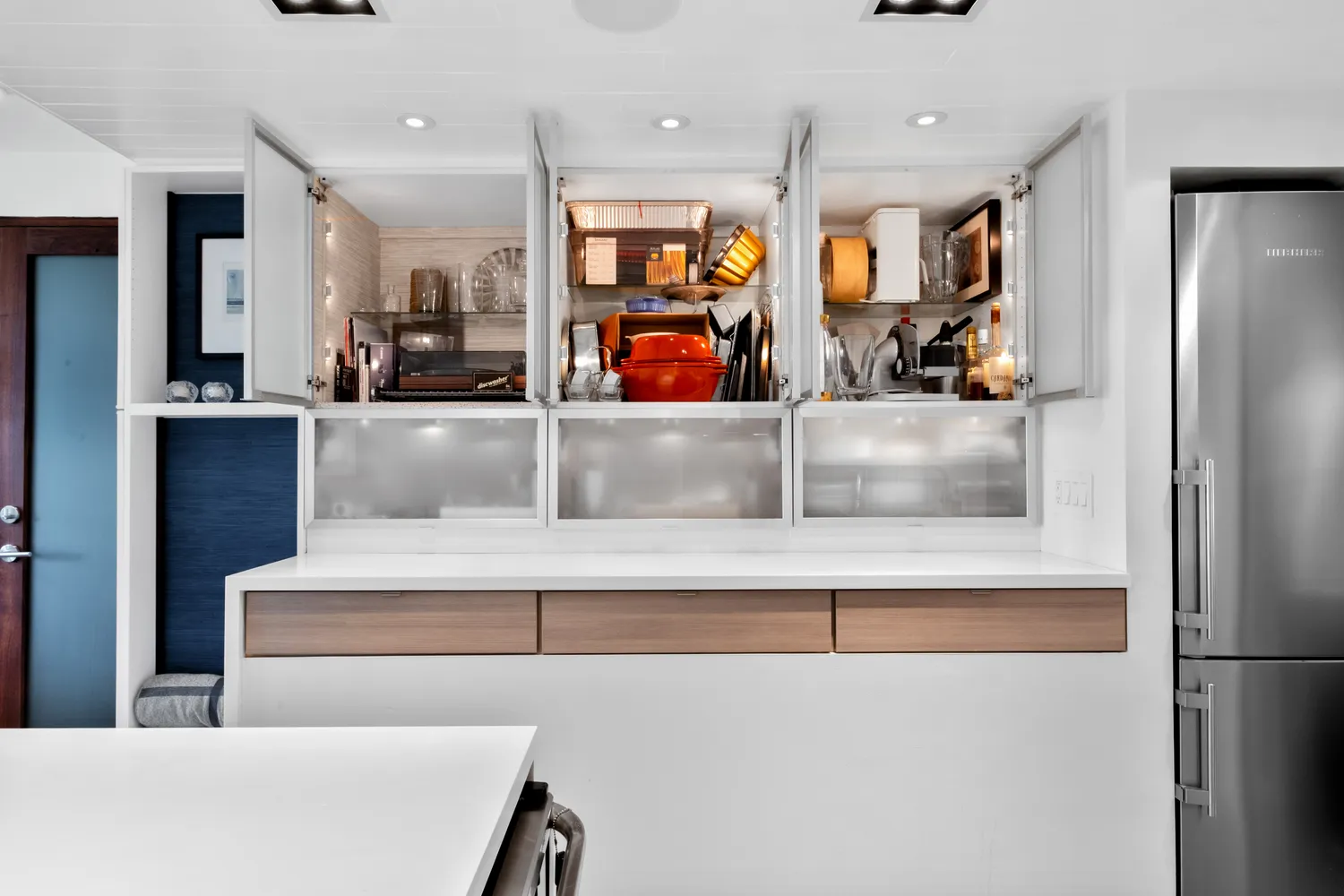 a kitchen with stainless steel appliances granite countertop a refrigerator and a sink