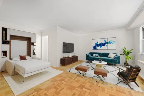 a bedroom with a bed and furniture