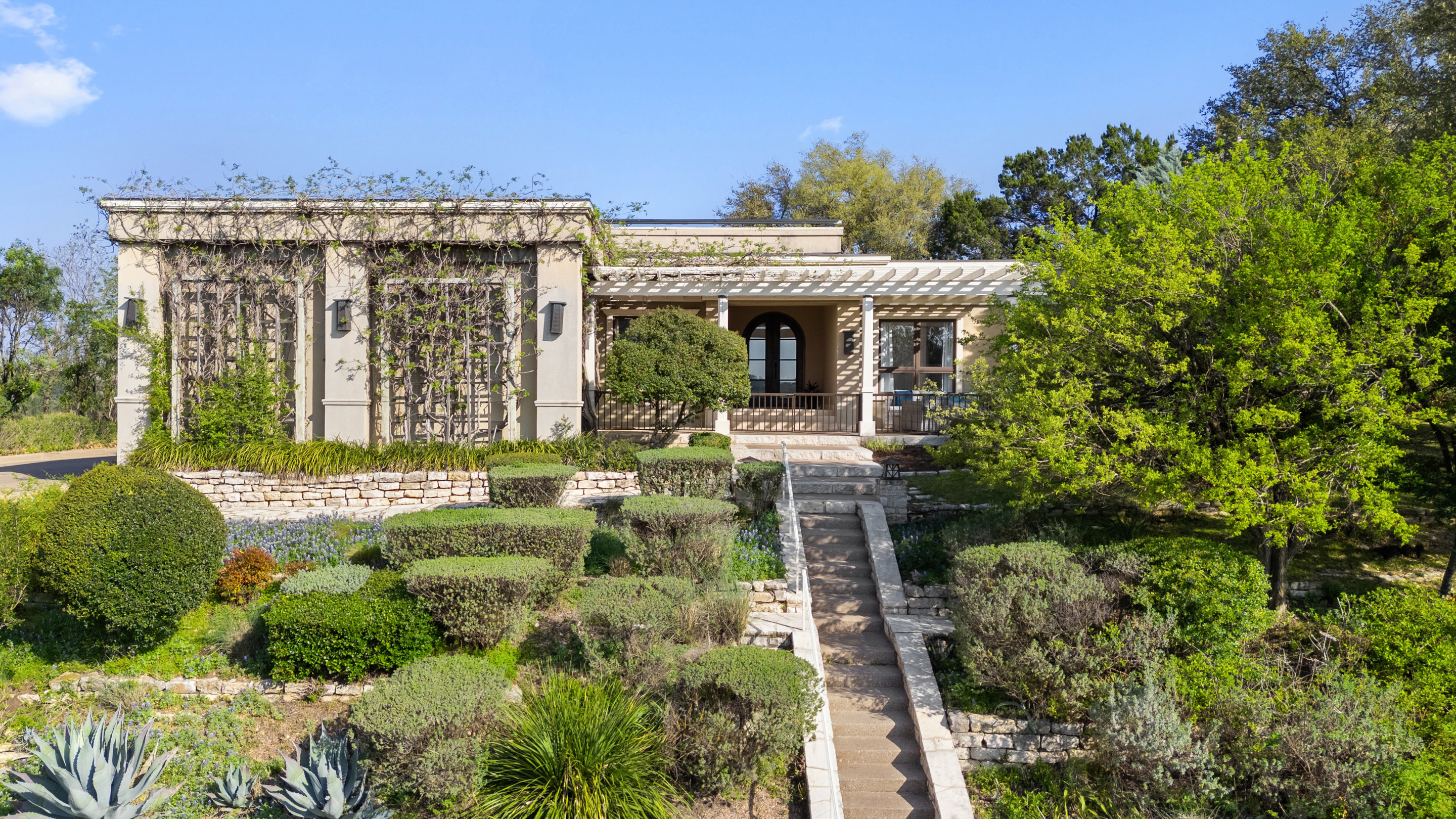 5319 Backtrail Drive Austin, TX 78731 - Photo 6 of 35 a front view of a house with a yard