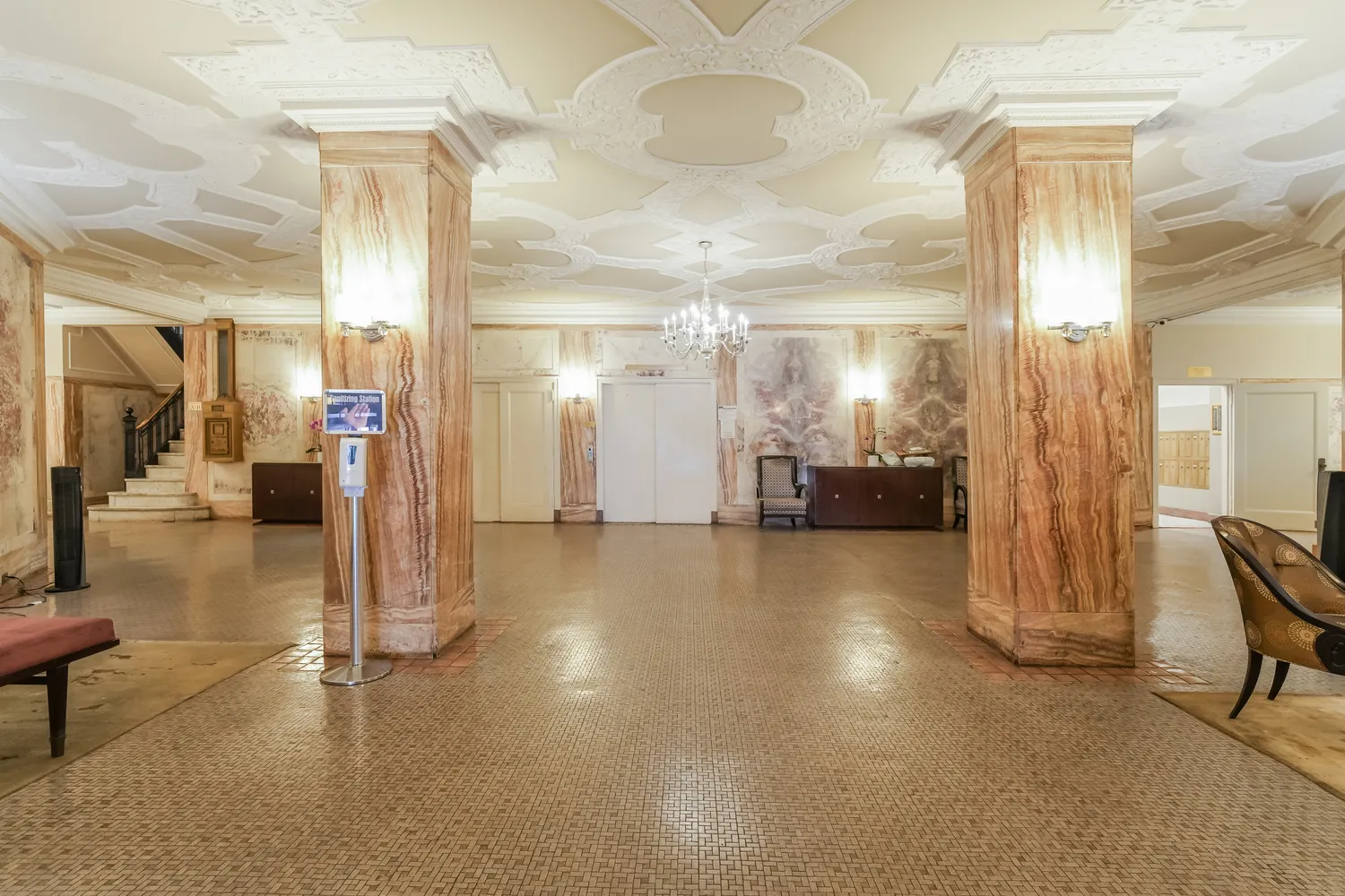 a view of a hallway with dining area and chandelier