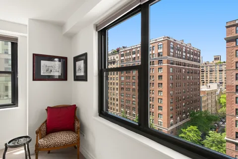 a view of a door and chair in the balcony