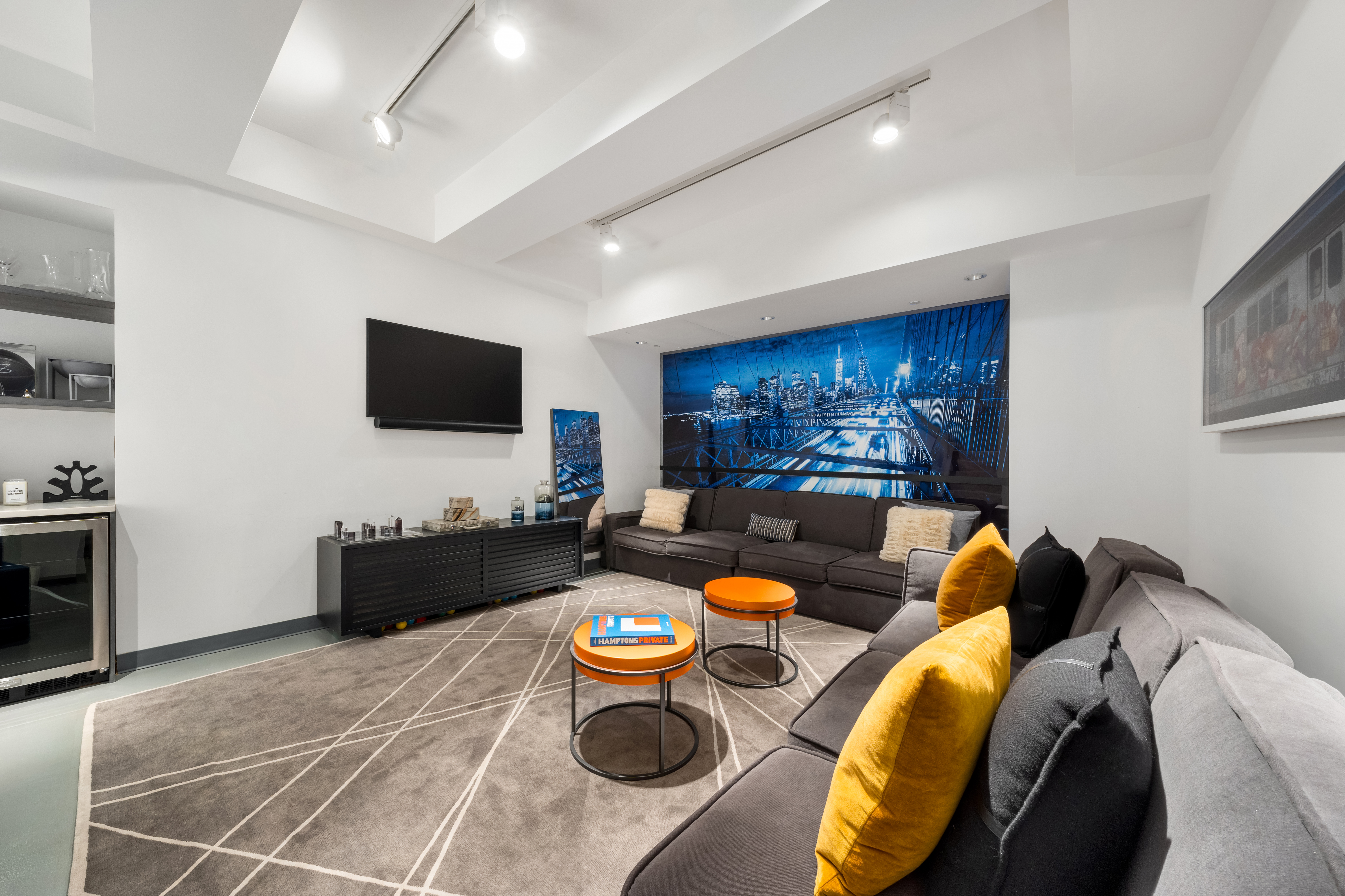 166 Perry Street, Unit 1B Manhattan, NY 10014 - Photo 8 of 17 a living room with furniture and a flat screen tv