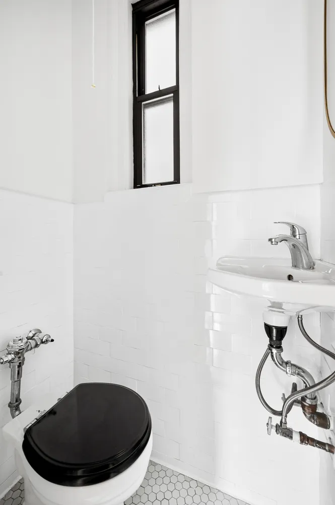 a living room with a black white checkered floor with a black white checkered floor