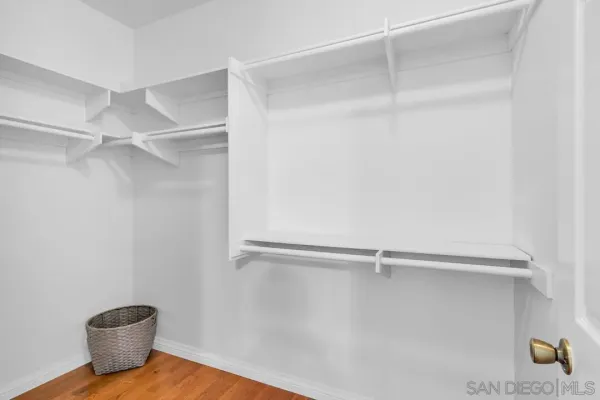 a spacious bathroom with a double vanity sink a mirror and shower