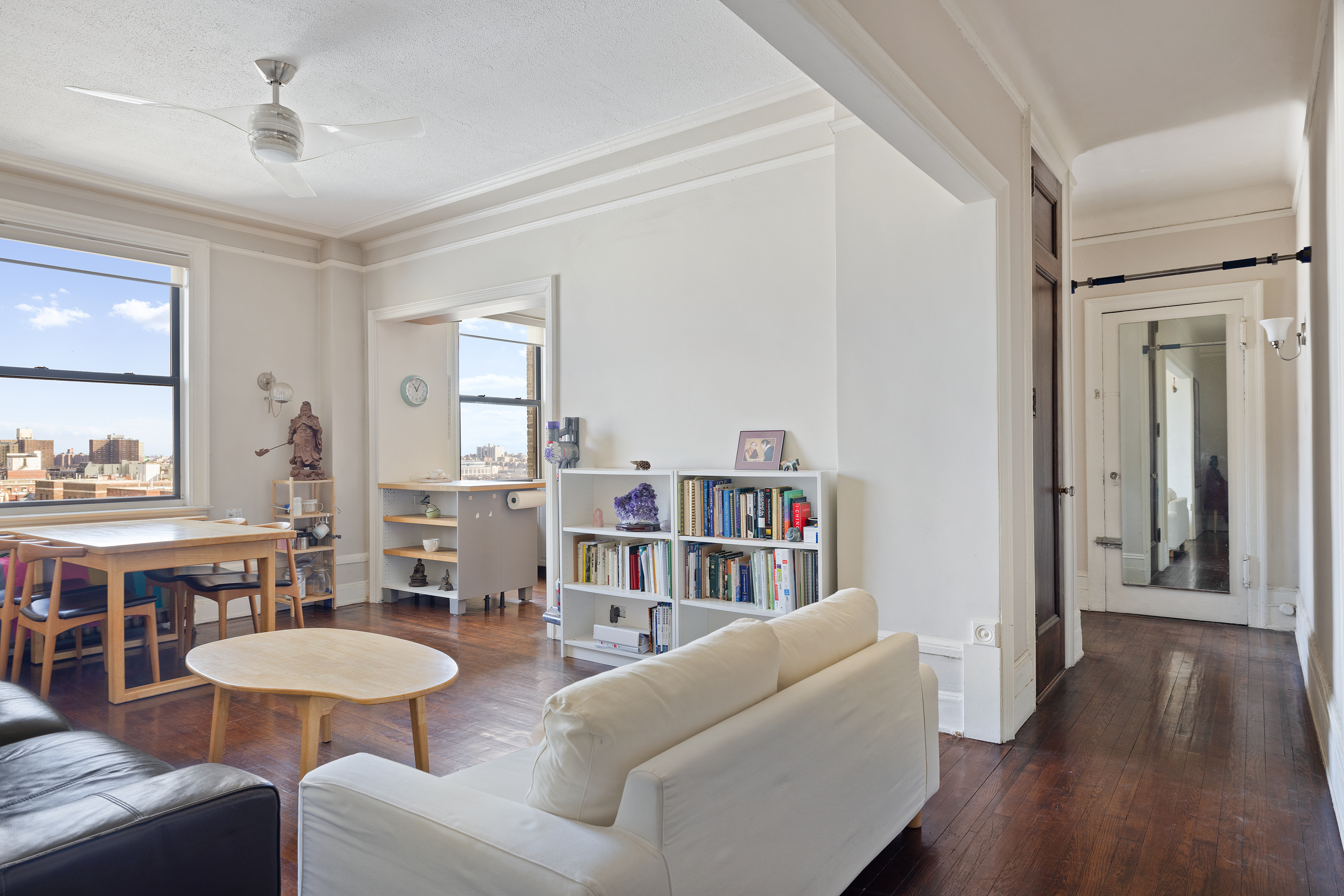 270 Convent Avenue, Unit 8B Manhattan, NY 10031 - Photo 1 of 10 a living room with furniture and a wooden floor