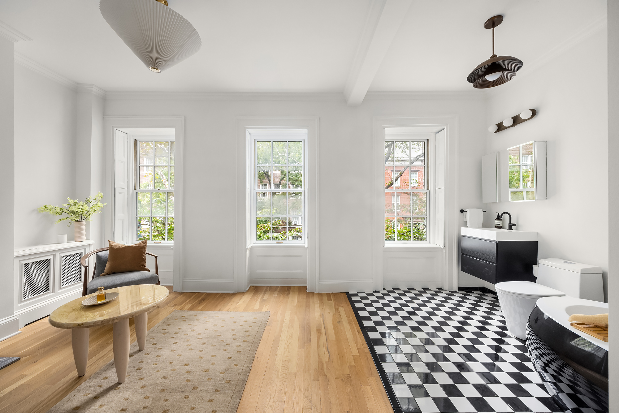 112 West 13th Street Manhattan, NY 10011 - Photo 25 of 46 a bedroom with a bed and wooden floor