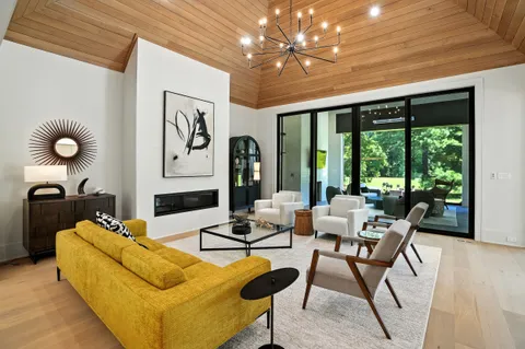 a living room with furniture ceiling fan and a rug
